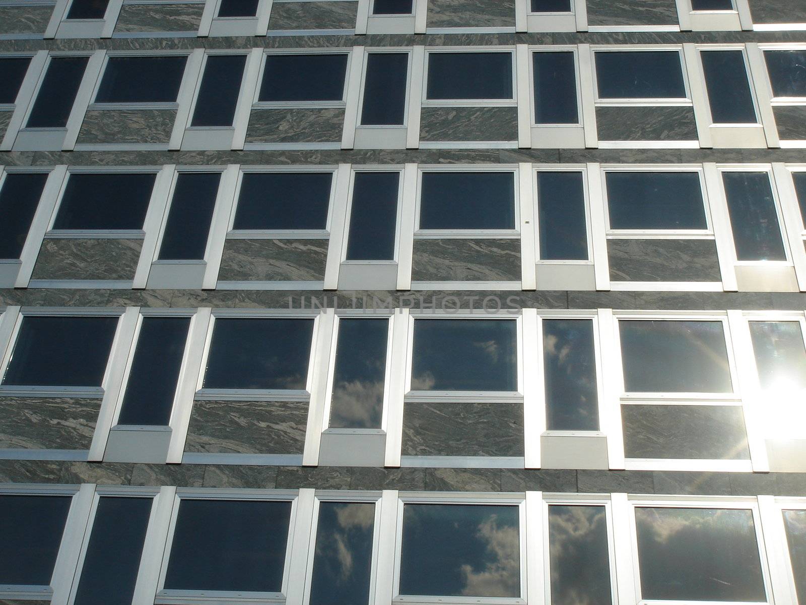 Glassed modern metallic facade of business building