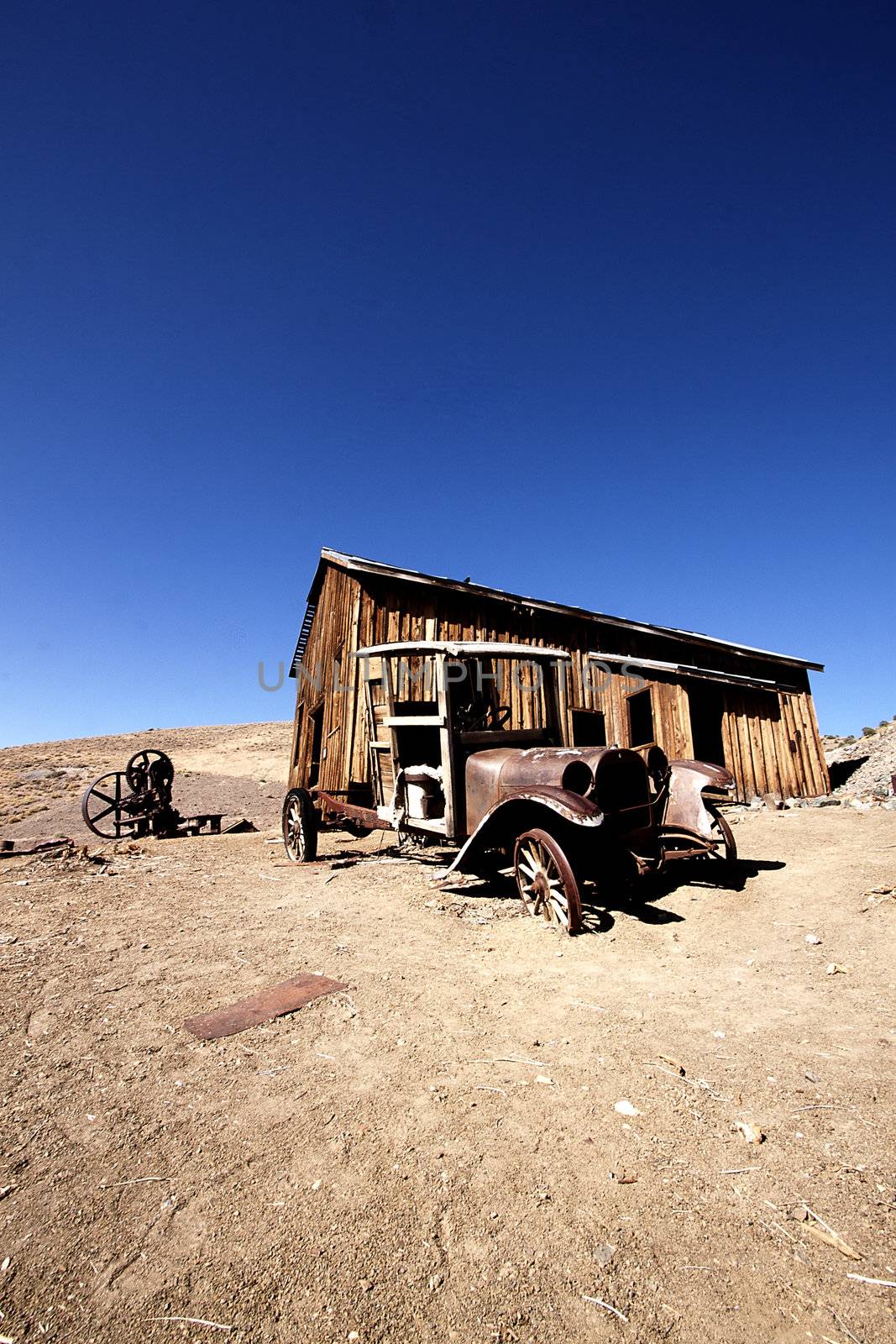 Old truck in front of an abandoned cabin