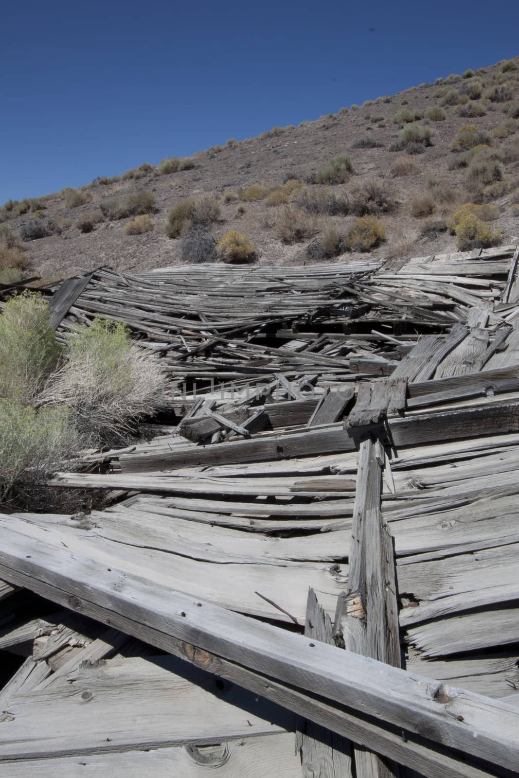 An old collapsed shack in the desert.