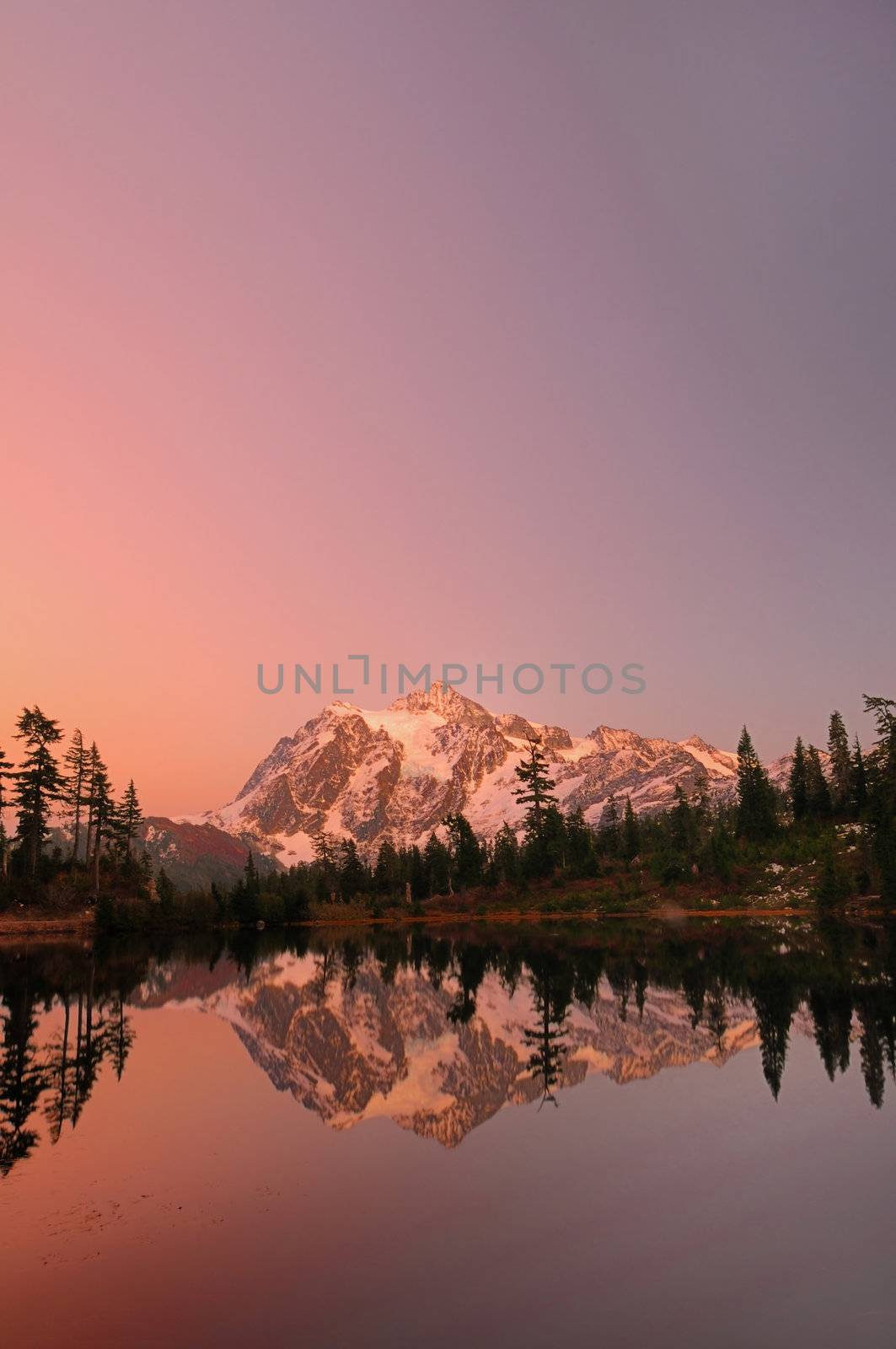 Vertical shot of Mount Shuksan with the alpine glow after sunset from Picture Lake.