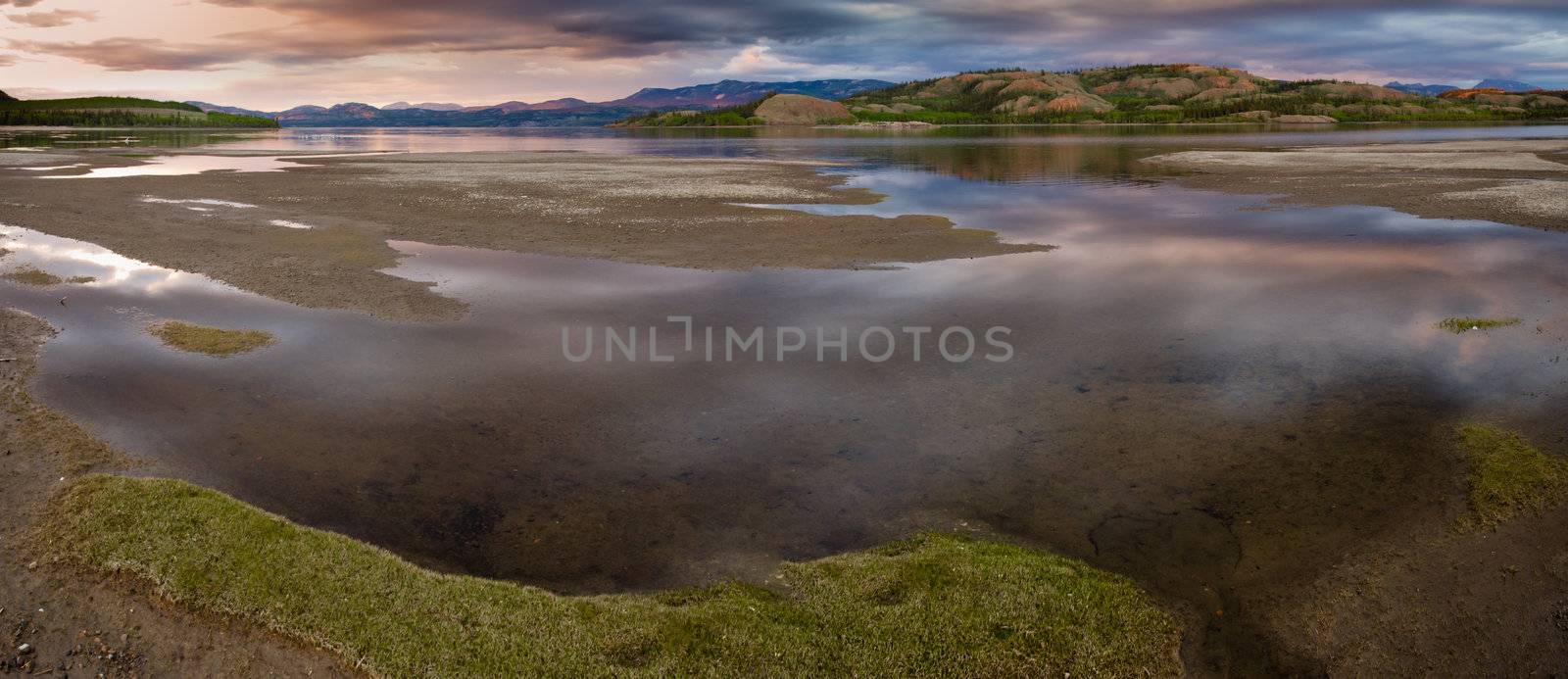 Dramatic Sky Mirrored on Lake Laberge Yukon Canada by PiLens