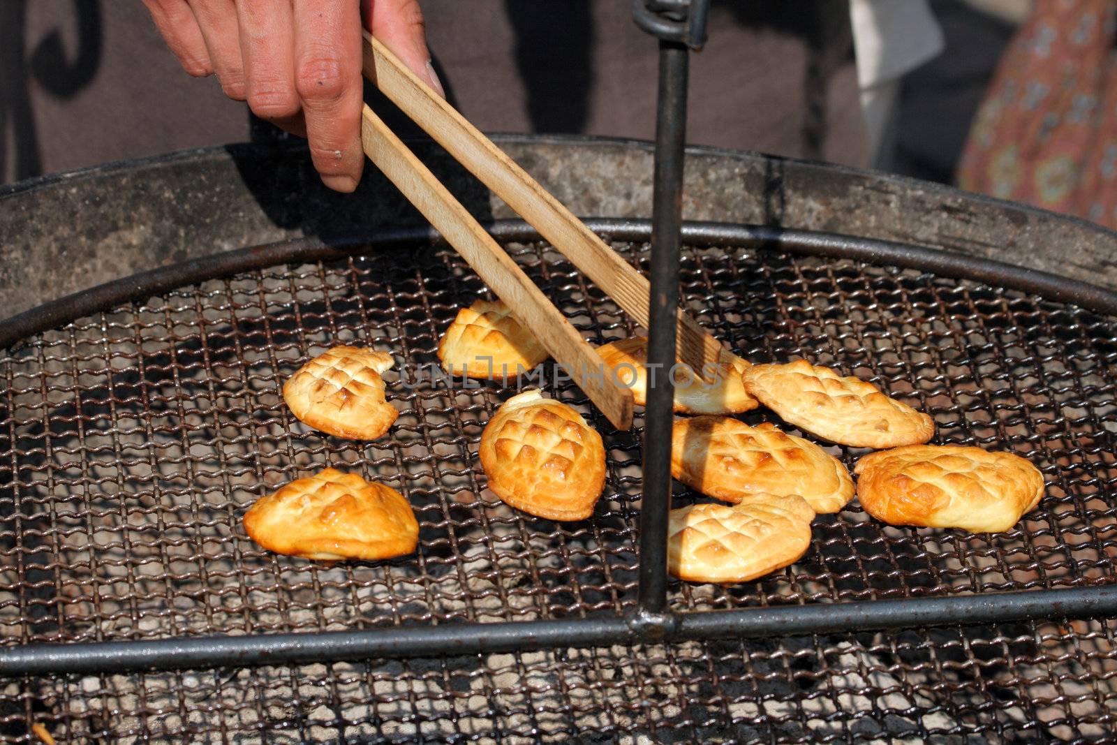 Traditional Polish smoked cheese known as oscypek on barbecue
