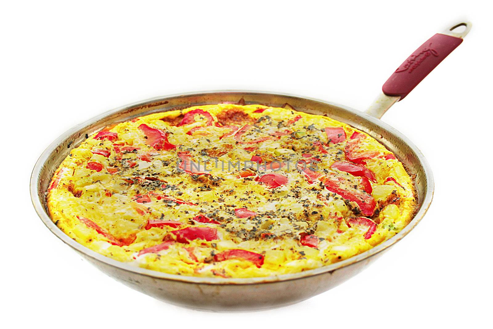 Ready omelette with vegetables in a frying pan.