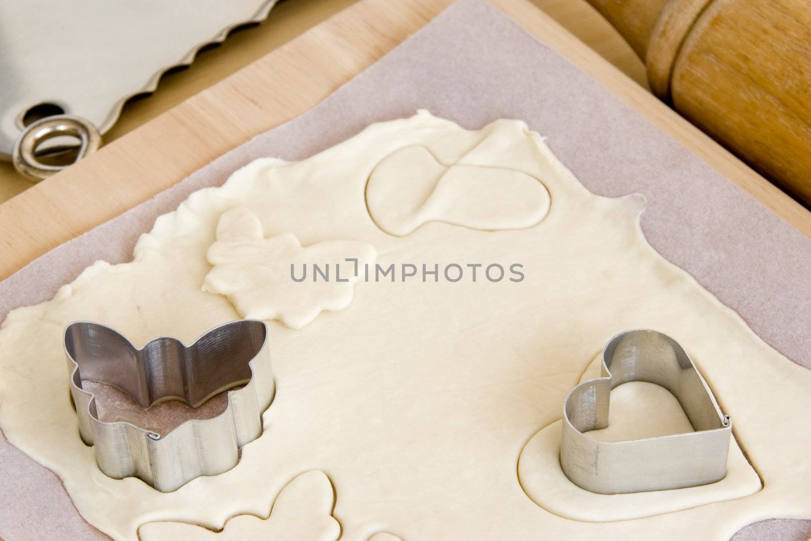 Image of cookie making with molds and pastry.