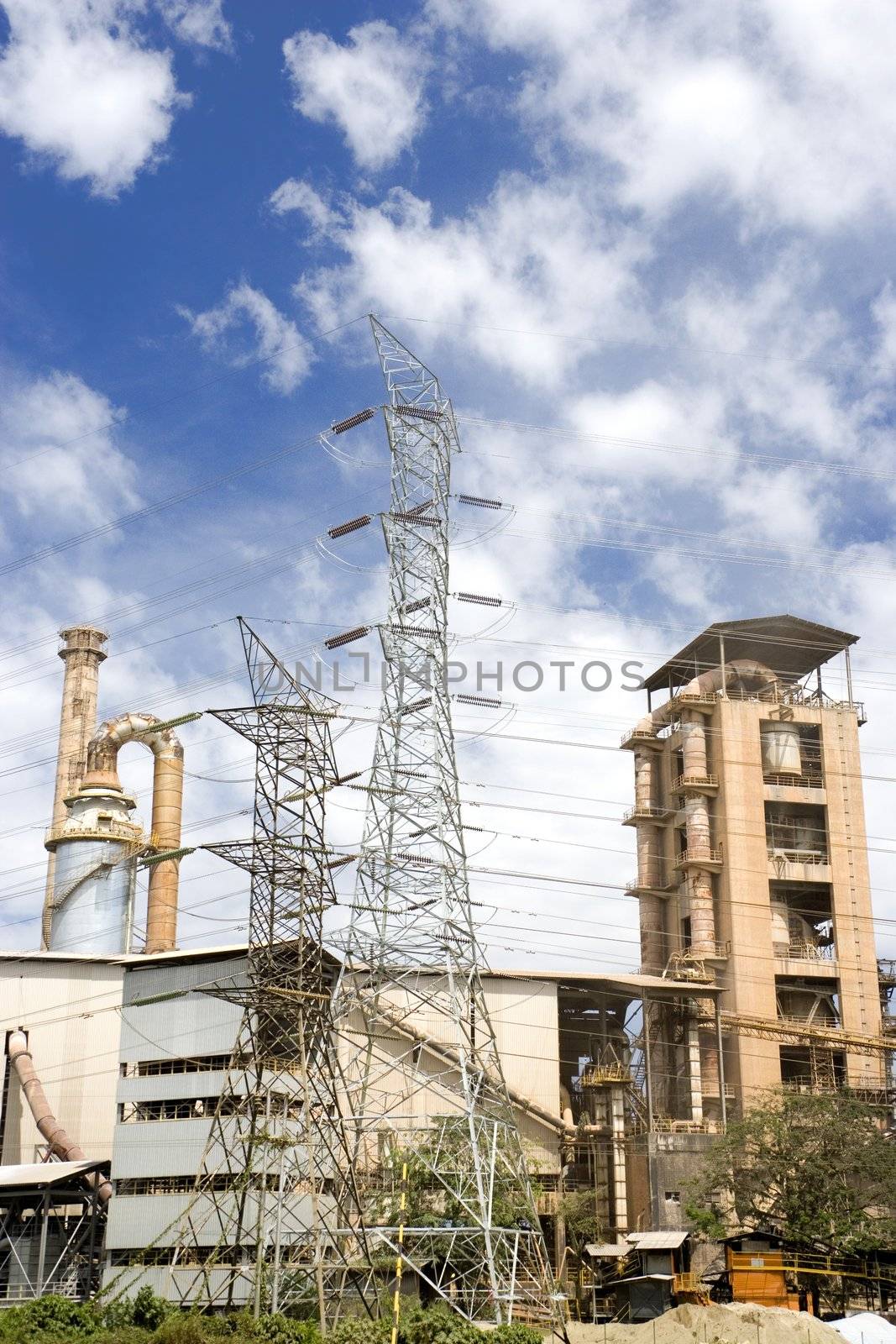 Image of a cement factory and power lines in Malaysia.
