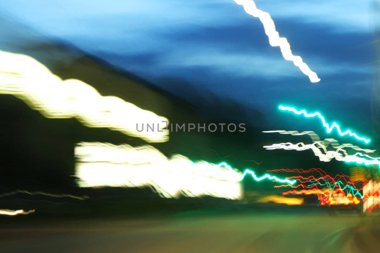 Lights in the road in the twilight of a long exposure time
