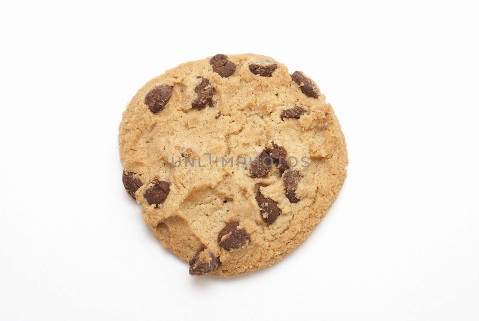 An isolated oven baked chocolate chip cookie.