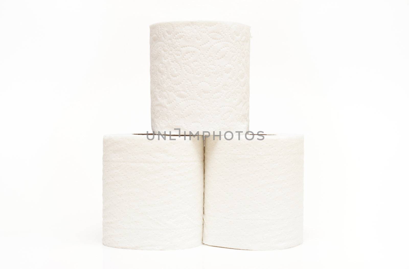A stack of three rolls of toilet paper.