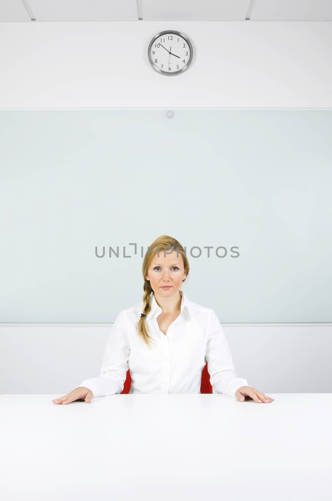 Young confident woman in her office