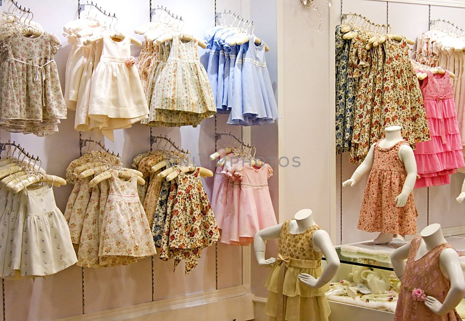 Image of children's clothes in a shop.

