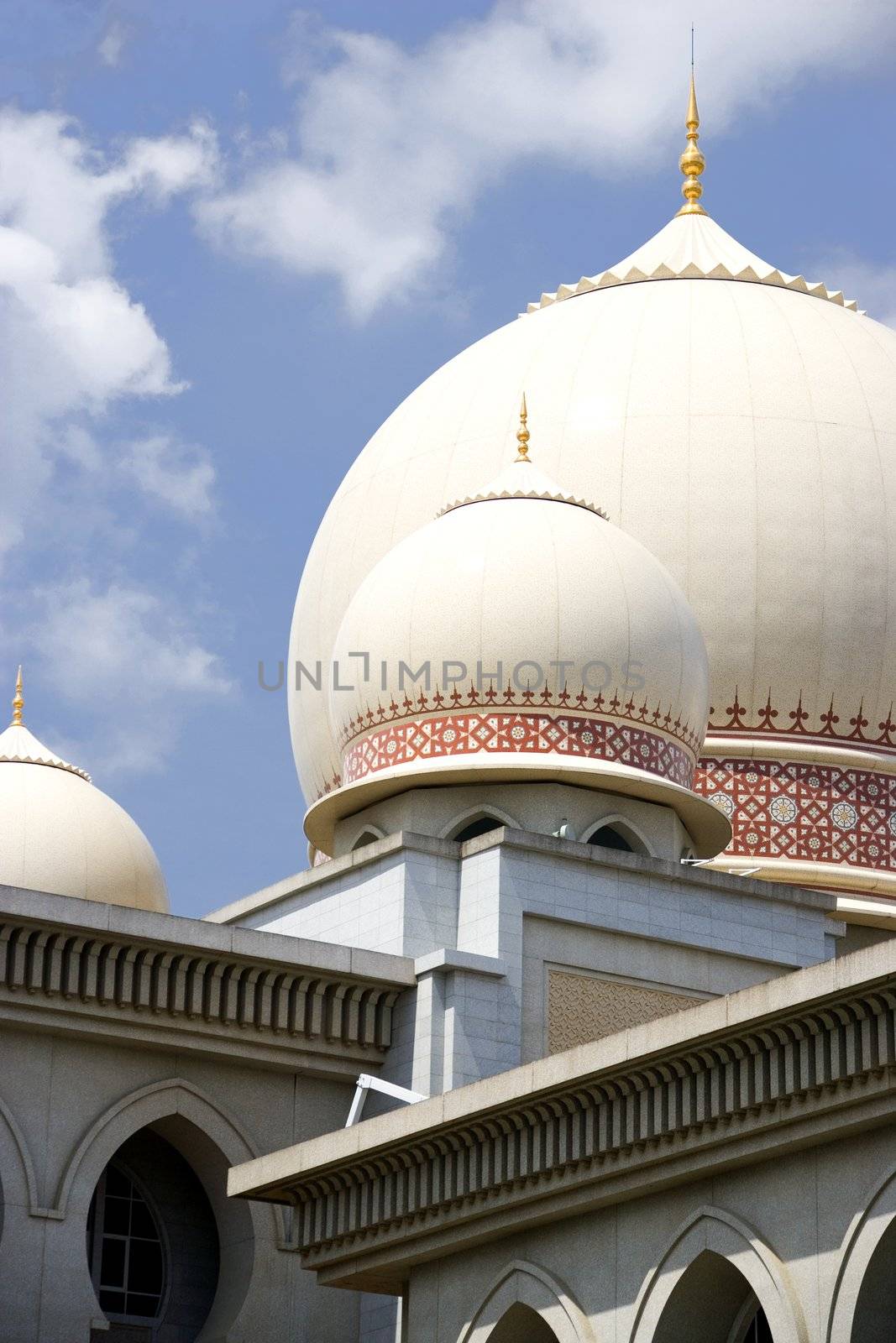 Image of a domes on a bulding incorporating Islamic architecture.