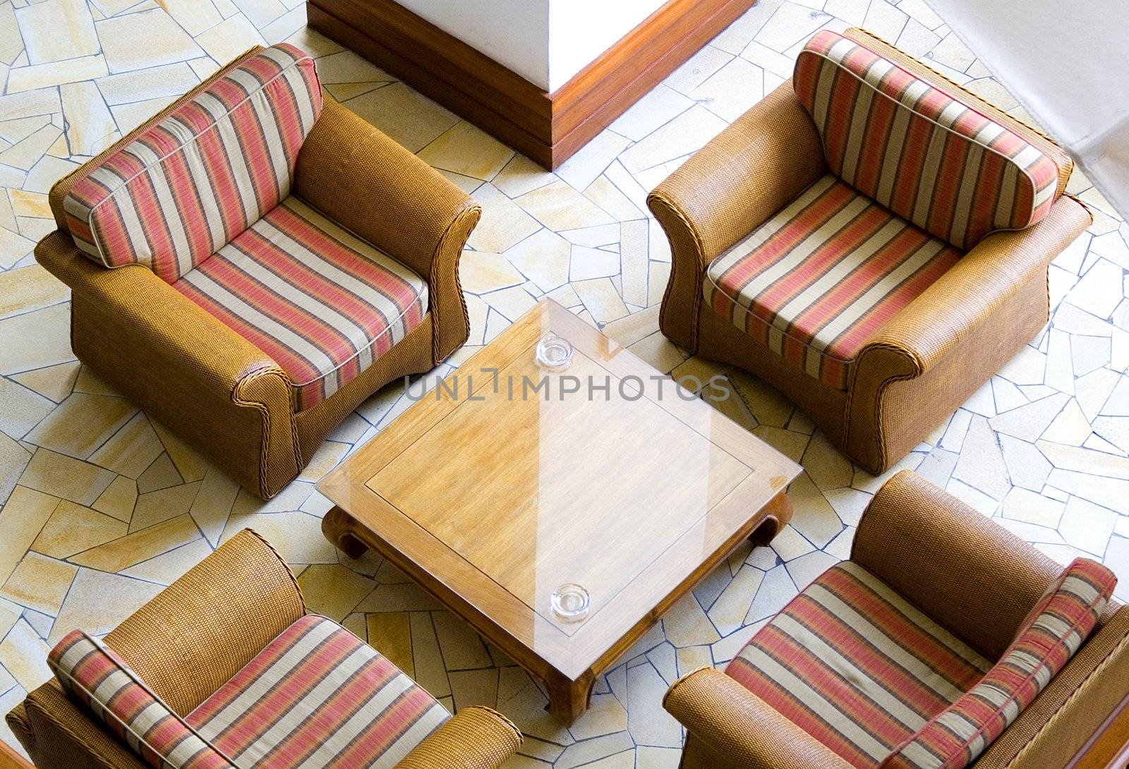 Image of four easy chairs in symmetry.