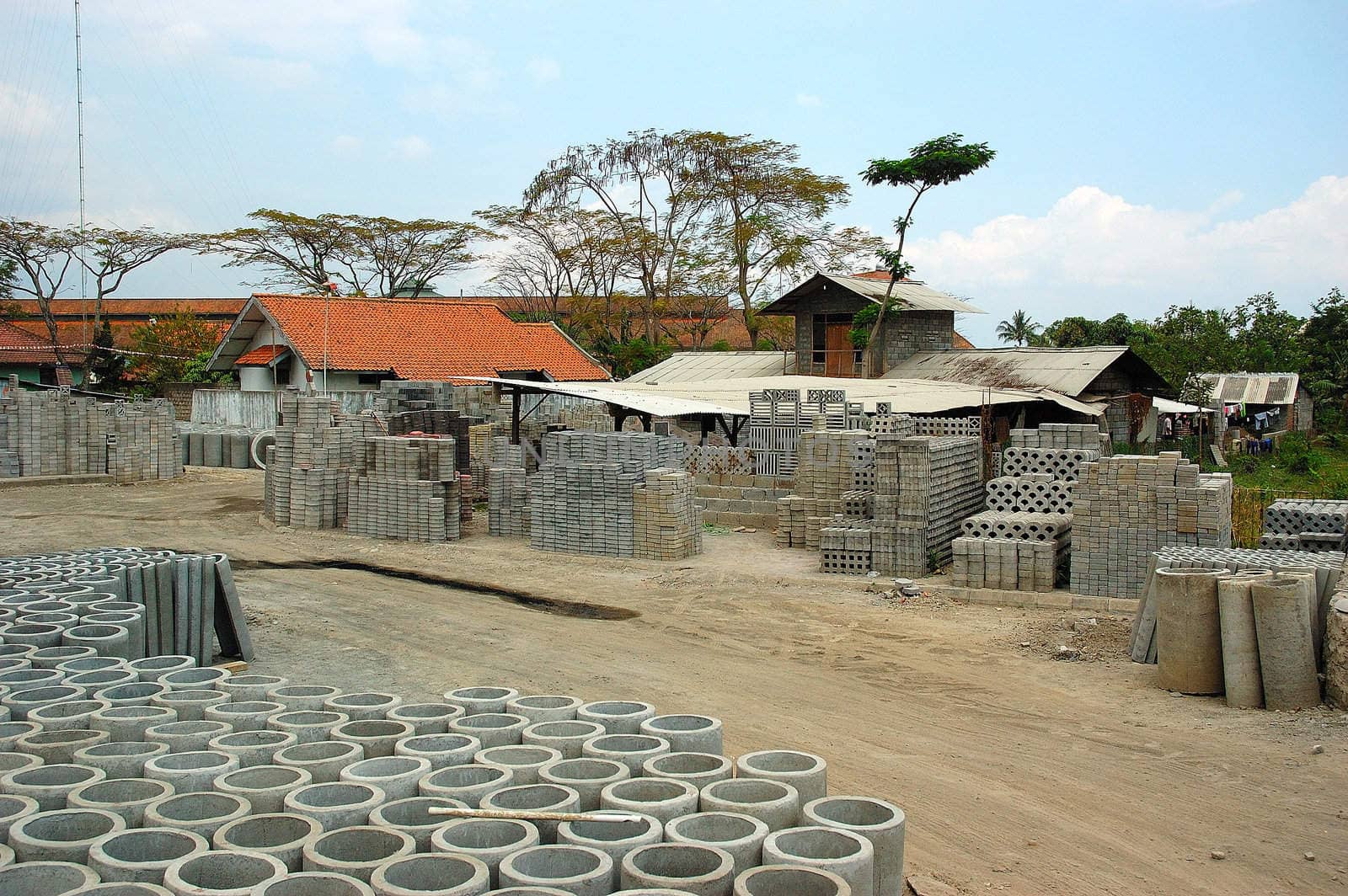 The outdoors section of a factory producing concrete and concrete shaped objects