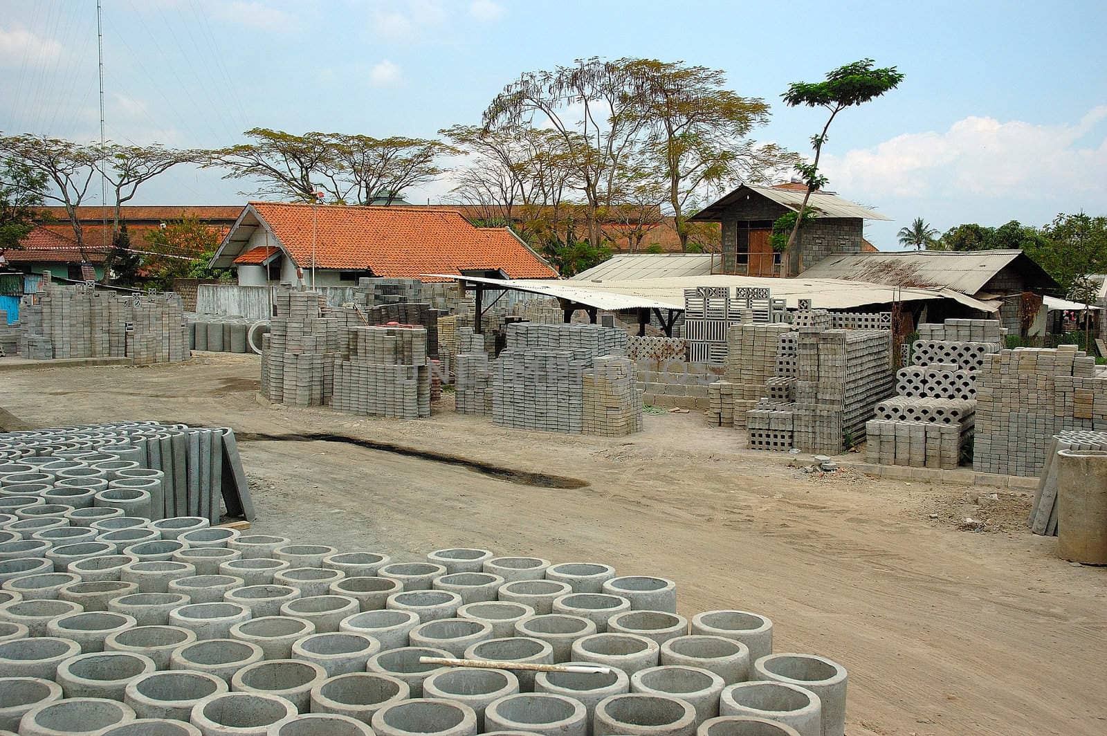 The outdoors section of a factory producing concrete and concrete shaped objects