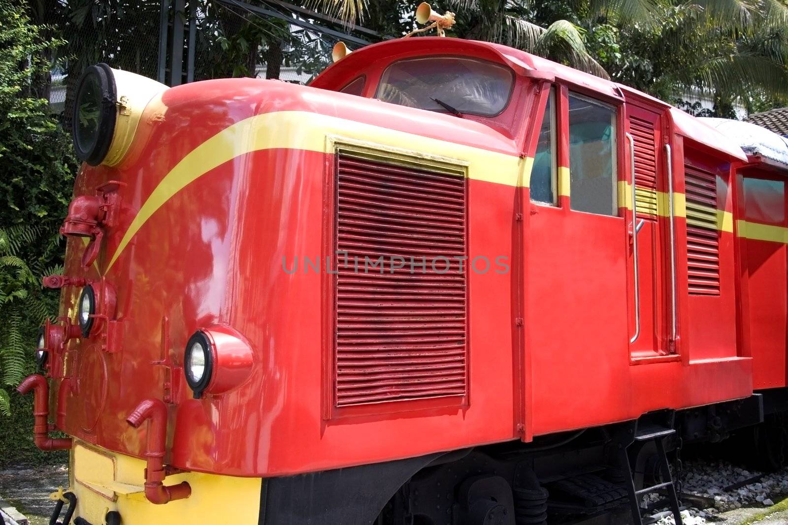 Image of a bright red vintage diesel train.