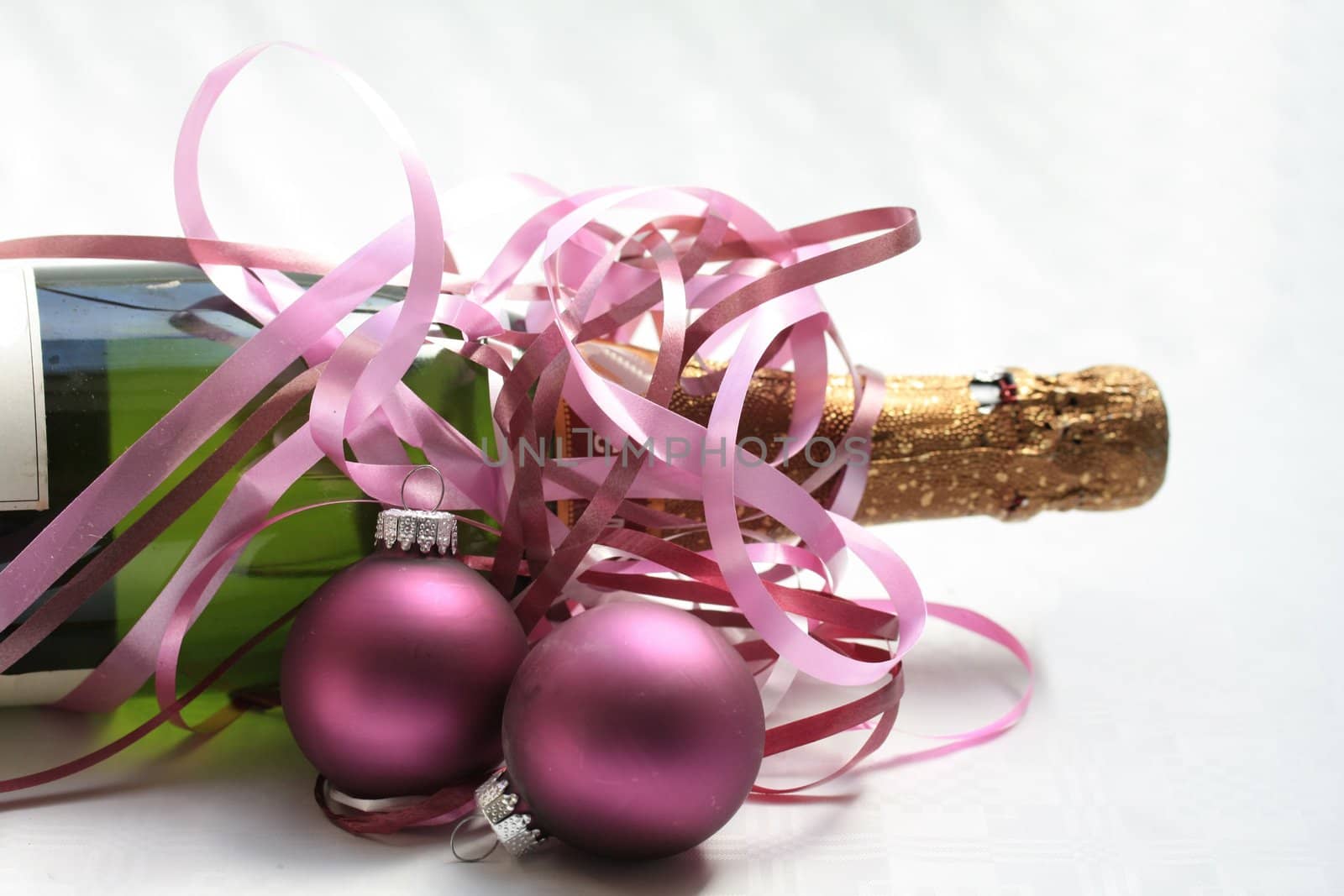 champagne bottle with christmas ornaments