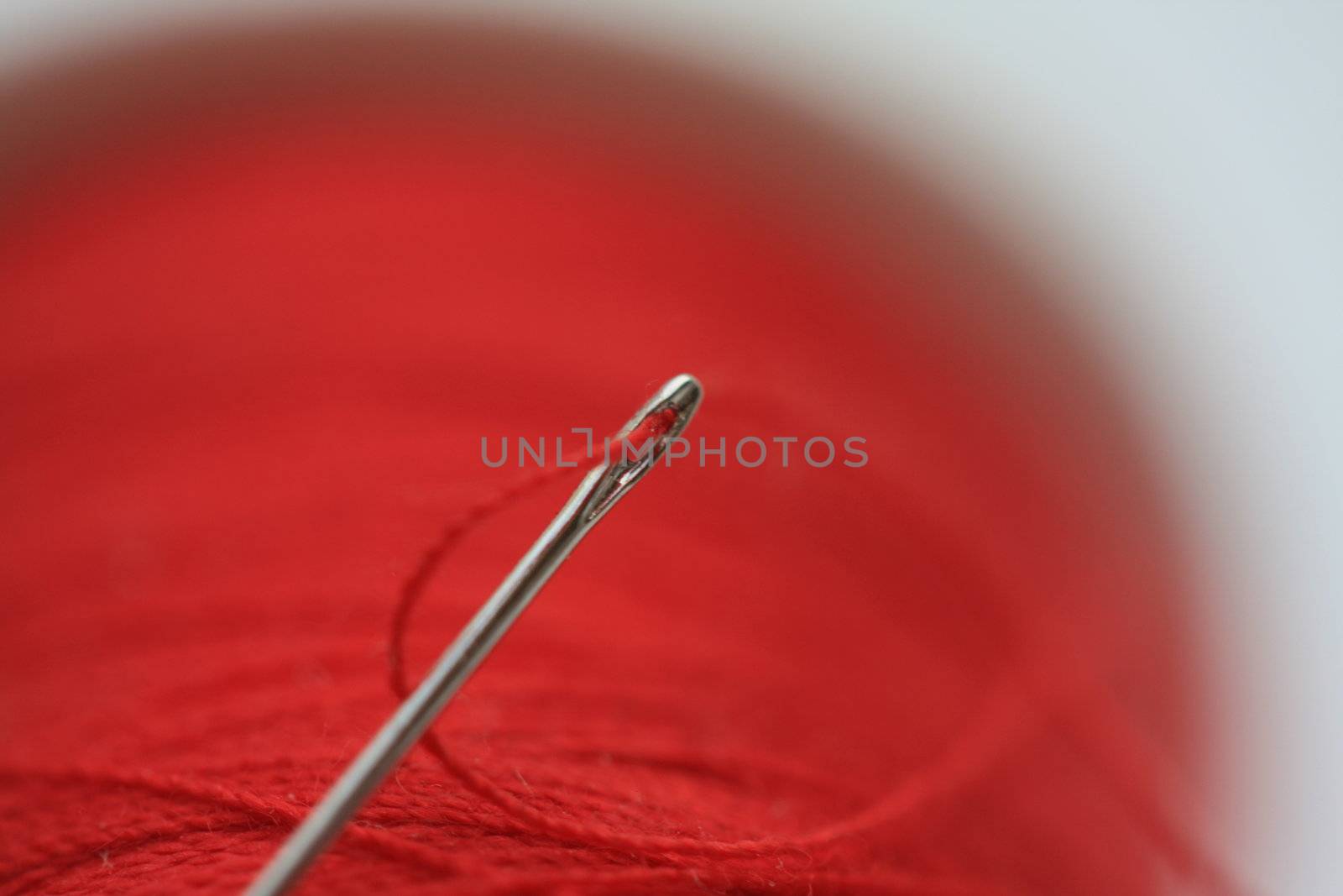 needle in a thread spool