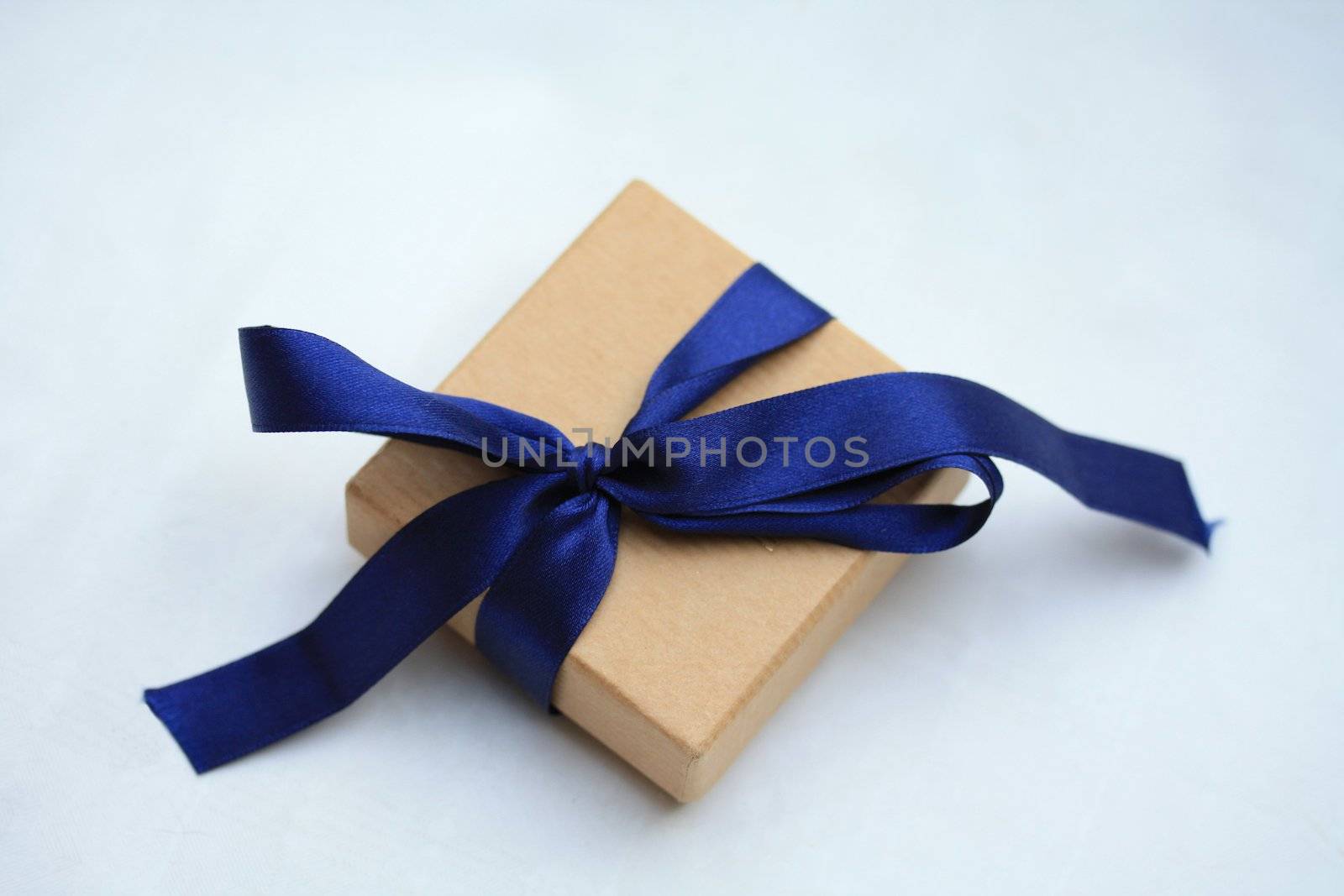 small jewel box with blue satin ribbon