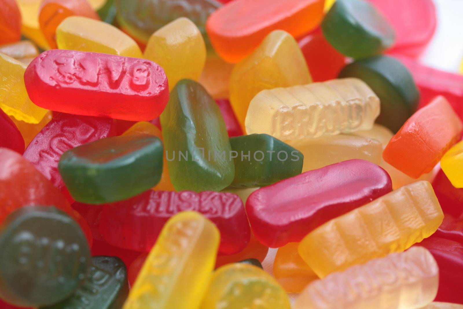 pile of assorted candy: liquorice allsorts, wine gums