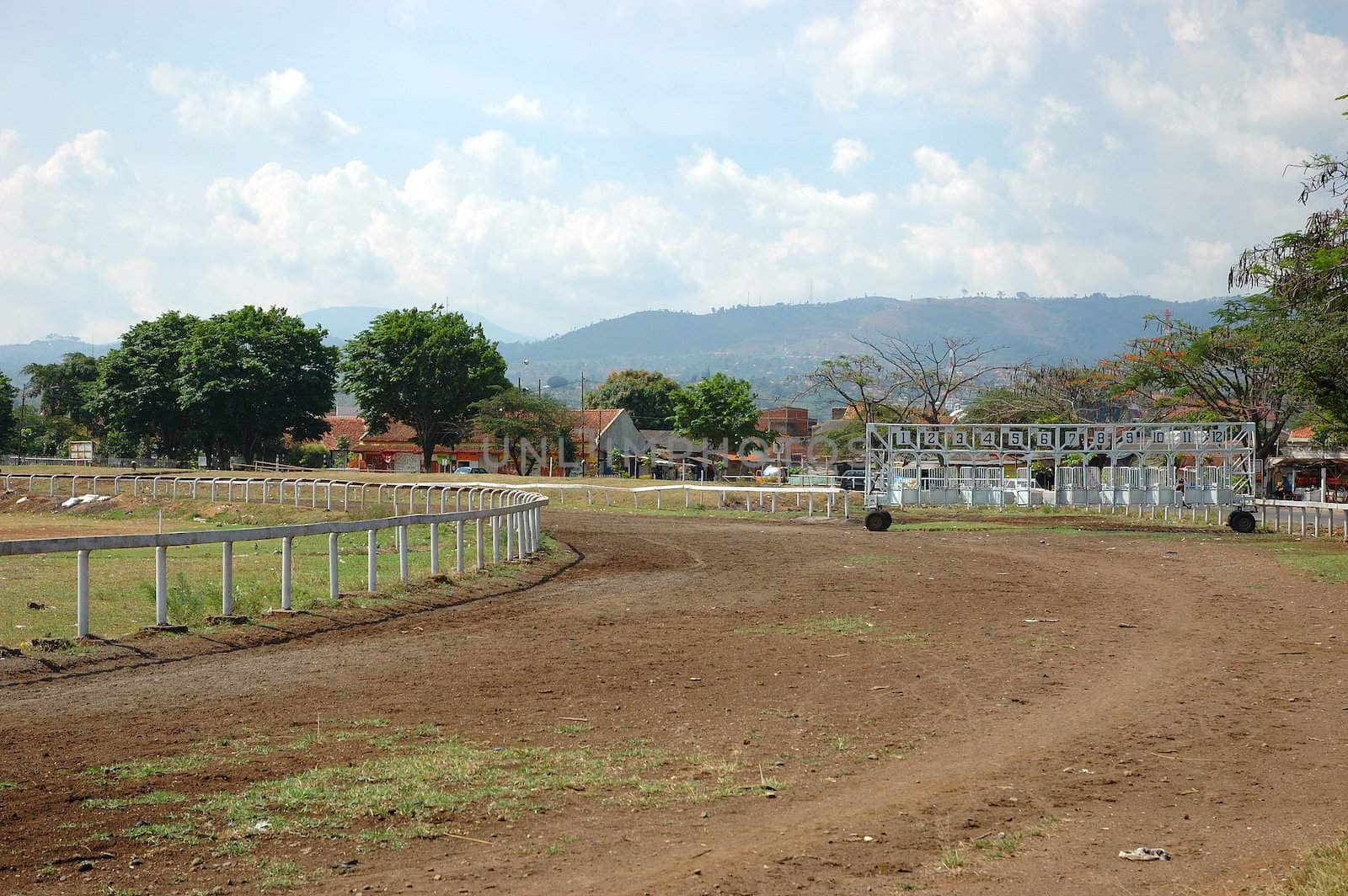 photograph of empty horse race tracking line
