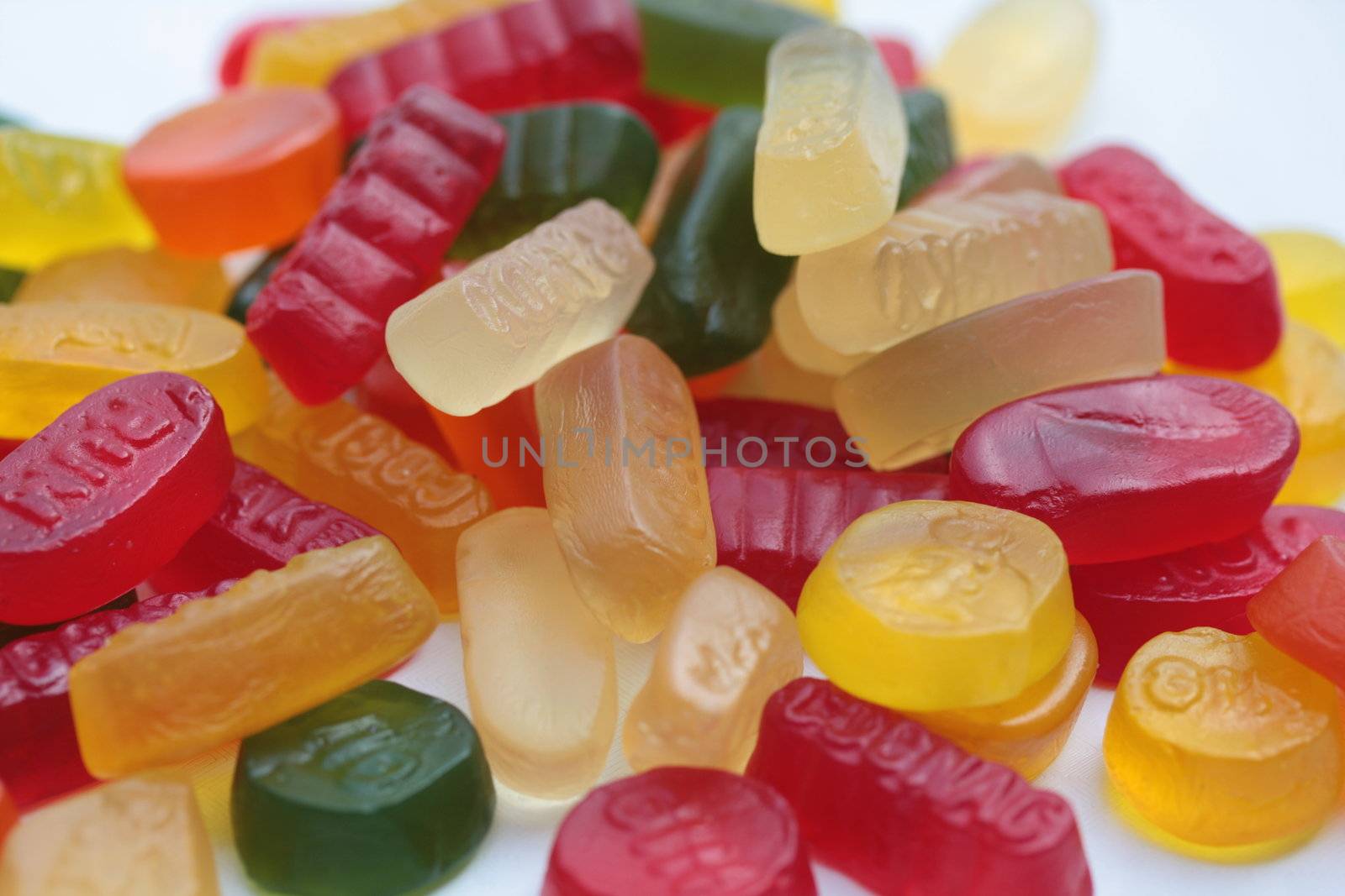 pile of assorted candy: liquorice allsorts, wine gums