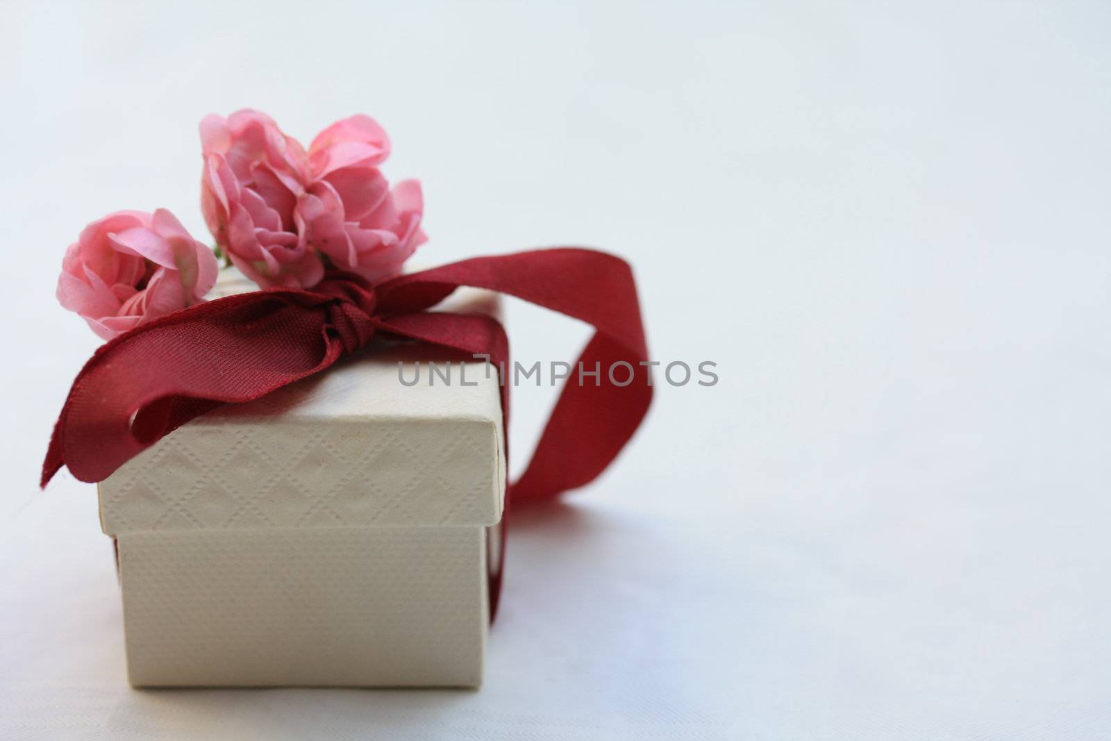 ring box with ribbon and roses