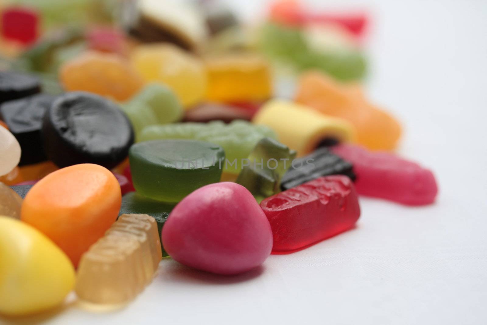 pile of assorted candies by studioportosabbia