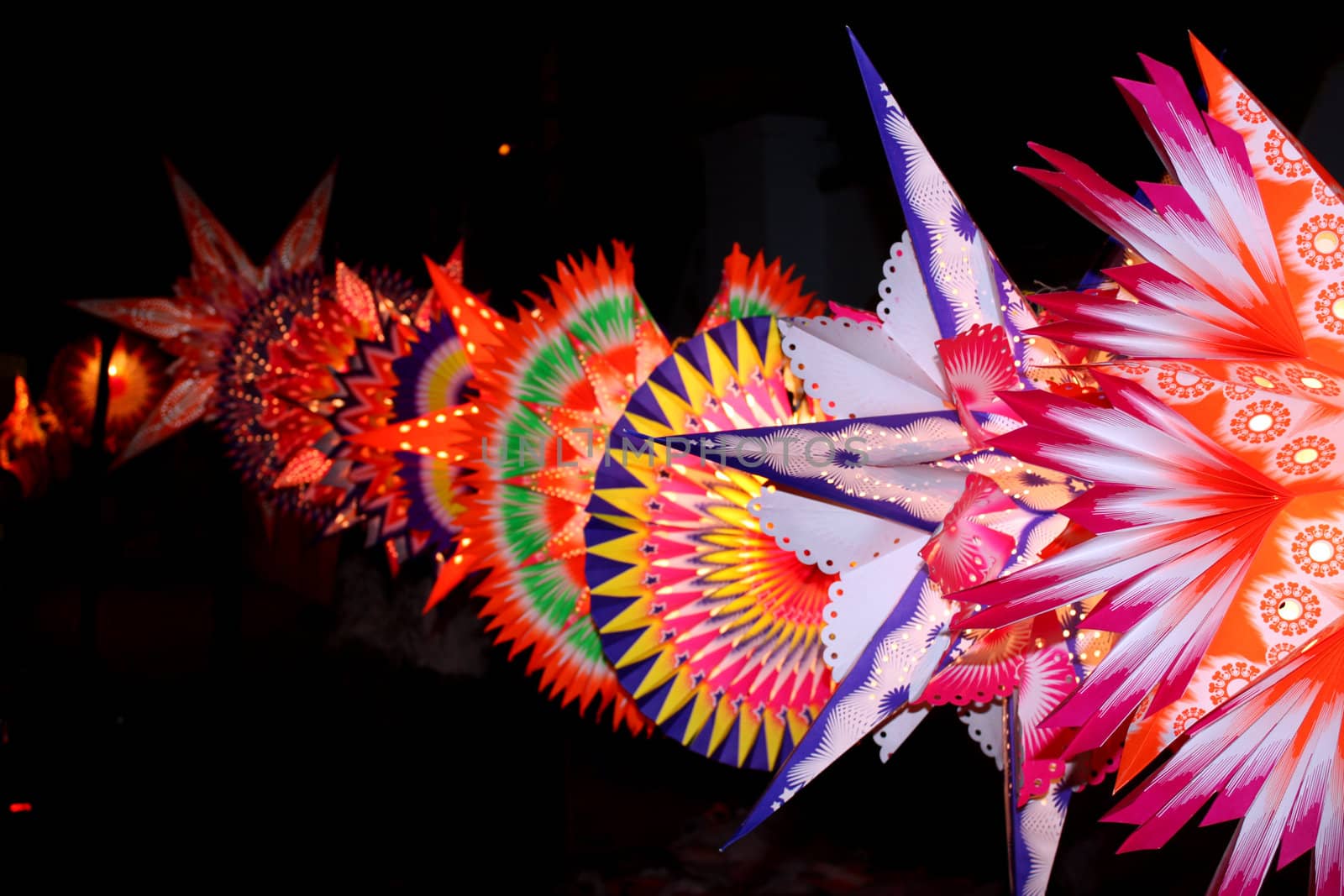 A line of beautiful colorful sky-lanters lit up on the occasion of a festival in India.