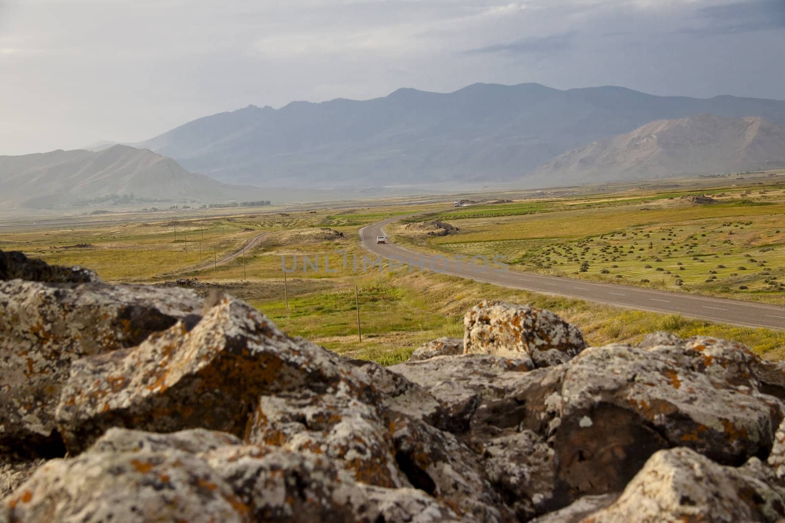 Route from Dogubayazit to Van. Sunset in background mountain. Green meadow.