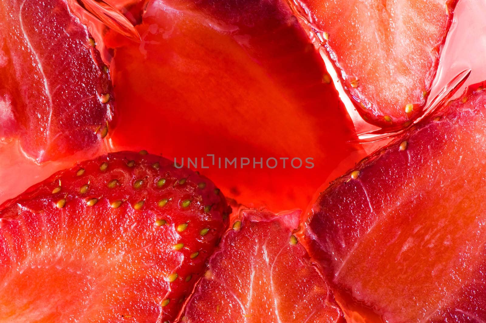 Close-up picture of jelly containing real juicy strawberries