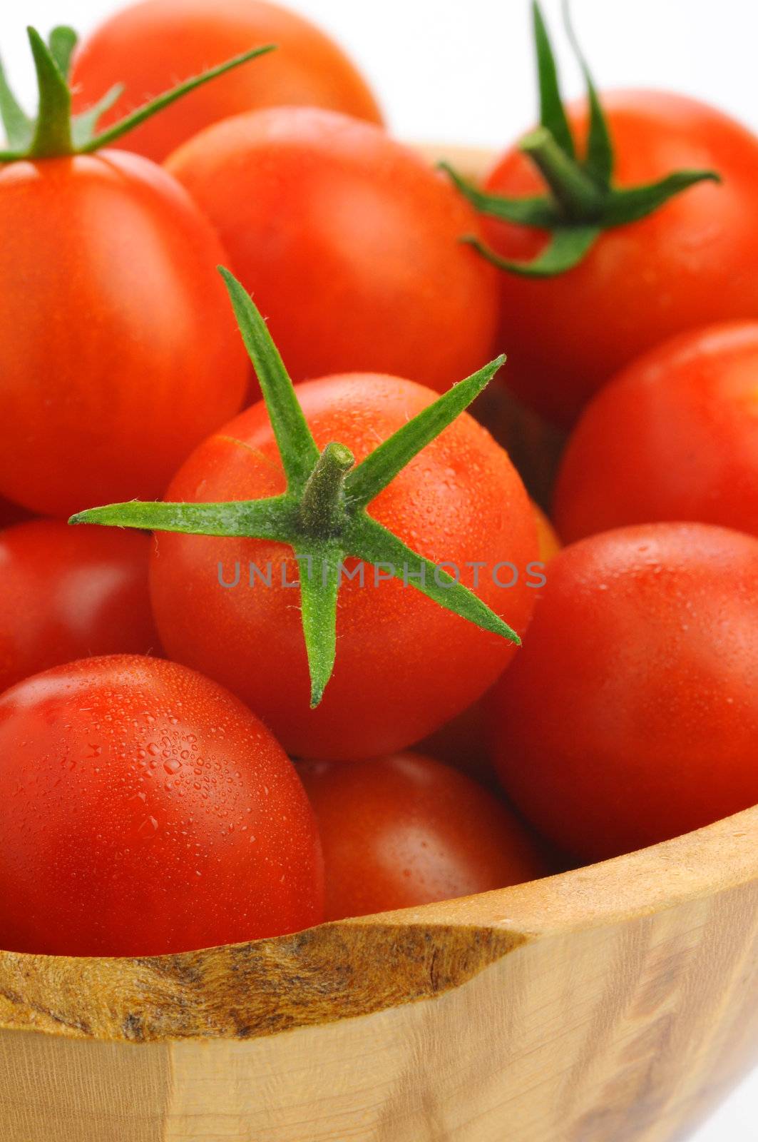 Fresh picked ripe cherry tomatoes photographed closeup.