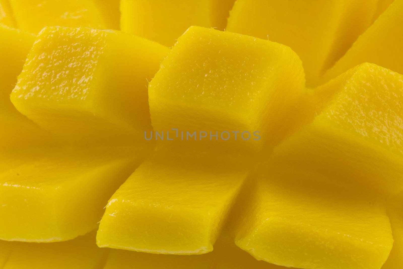 macro of freshly sliced mango fruit ready to eat