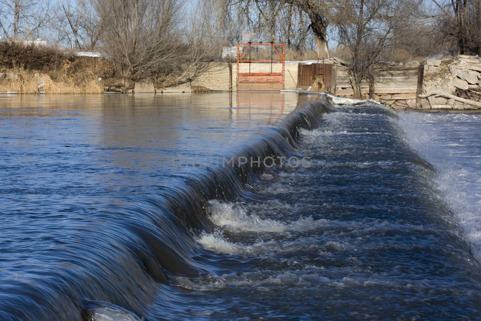 a dam on South Platte River in Colorado near Greeley diverting water for farmland irrigation
