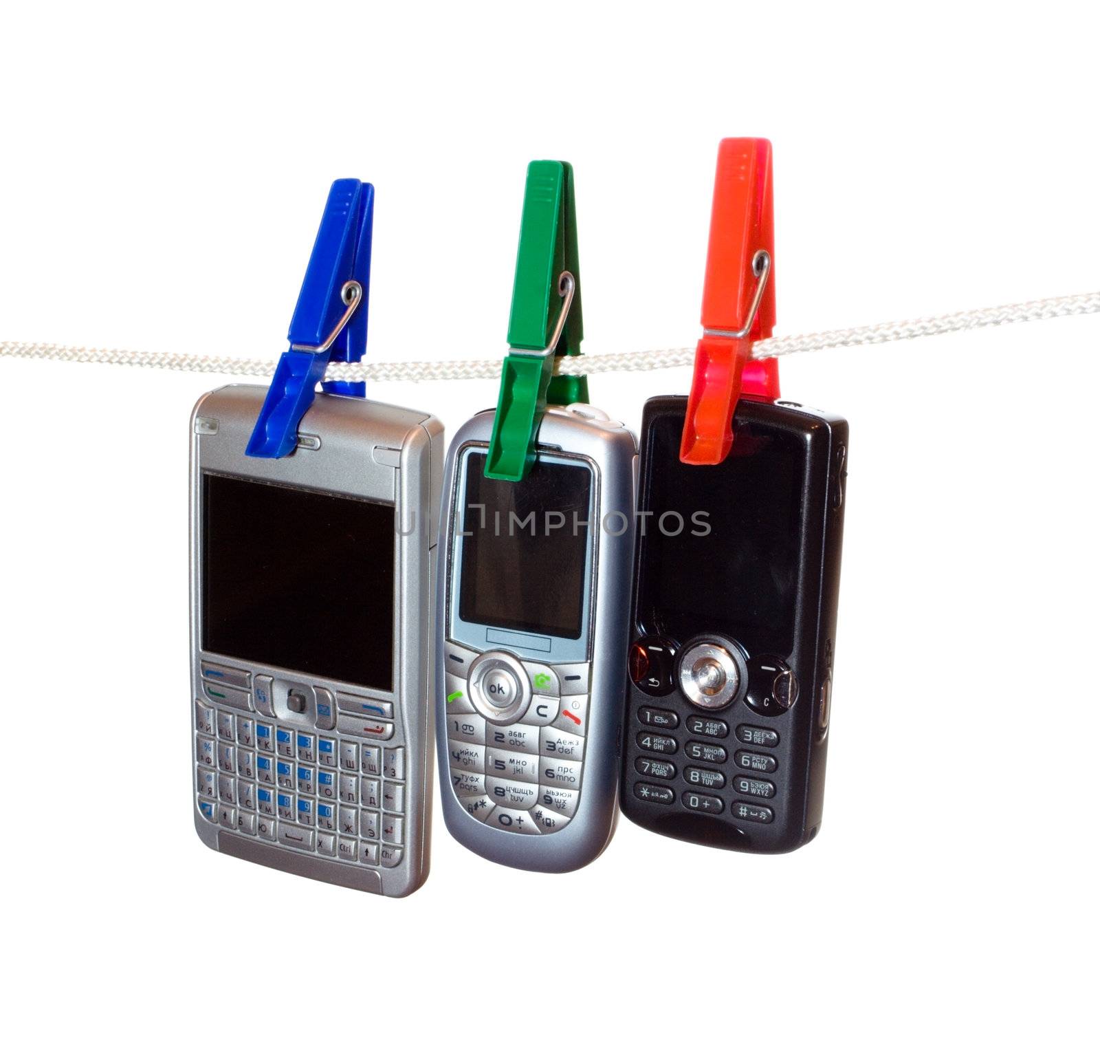 three mobile phones on a clothes line 2 by Alekcey