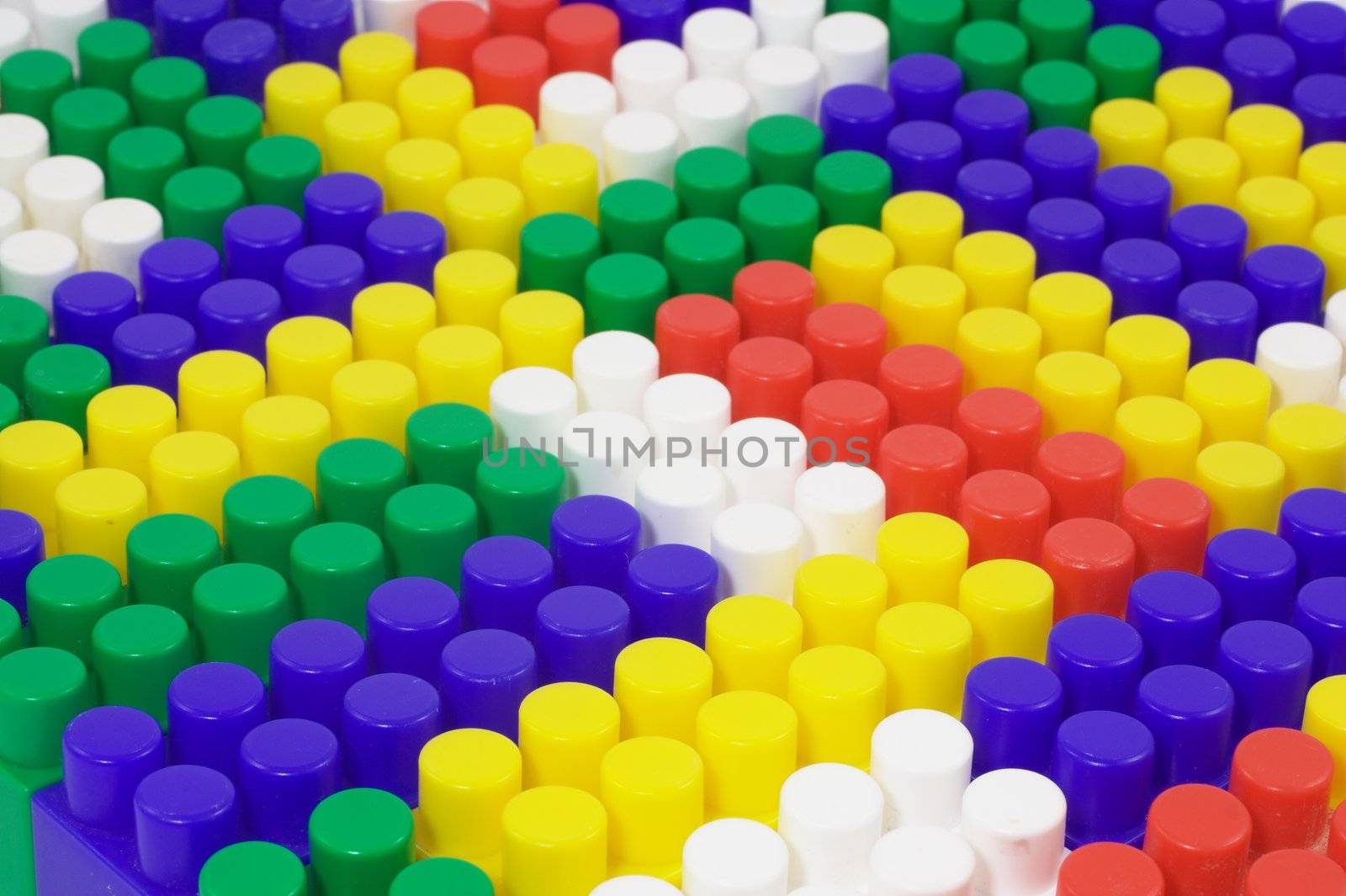 background from colored toy blocks, one by one
