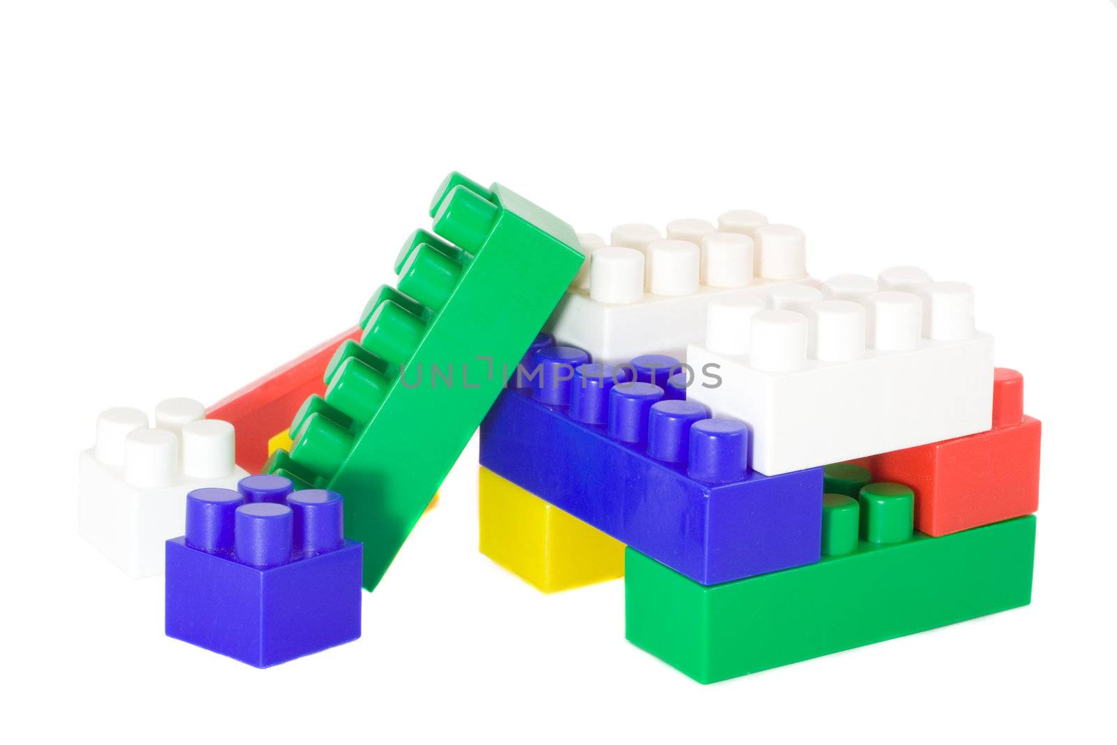 colored toy blocks different sizes, isolated on white