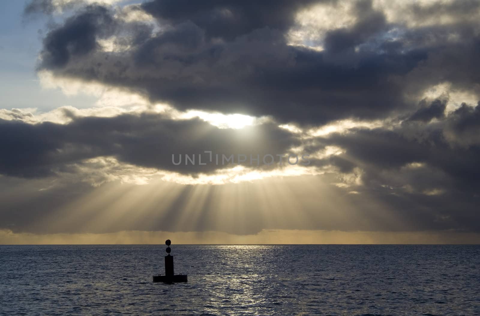 A gorgeous scene of rays of light on the horizon.