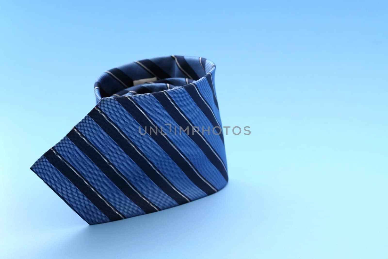 Blue tie against blue background