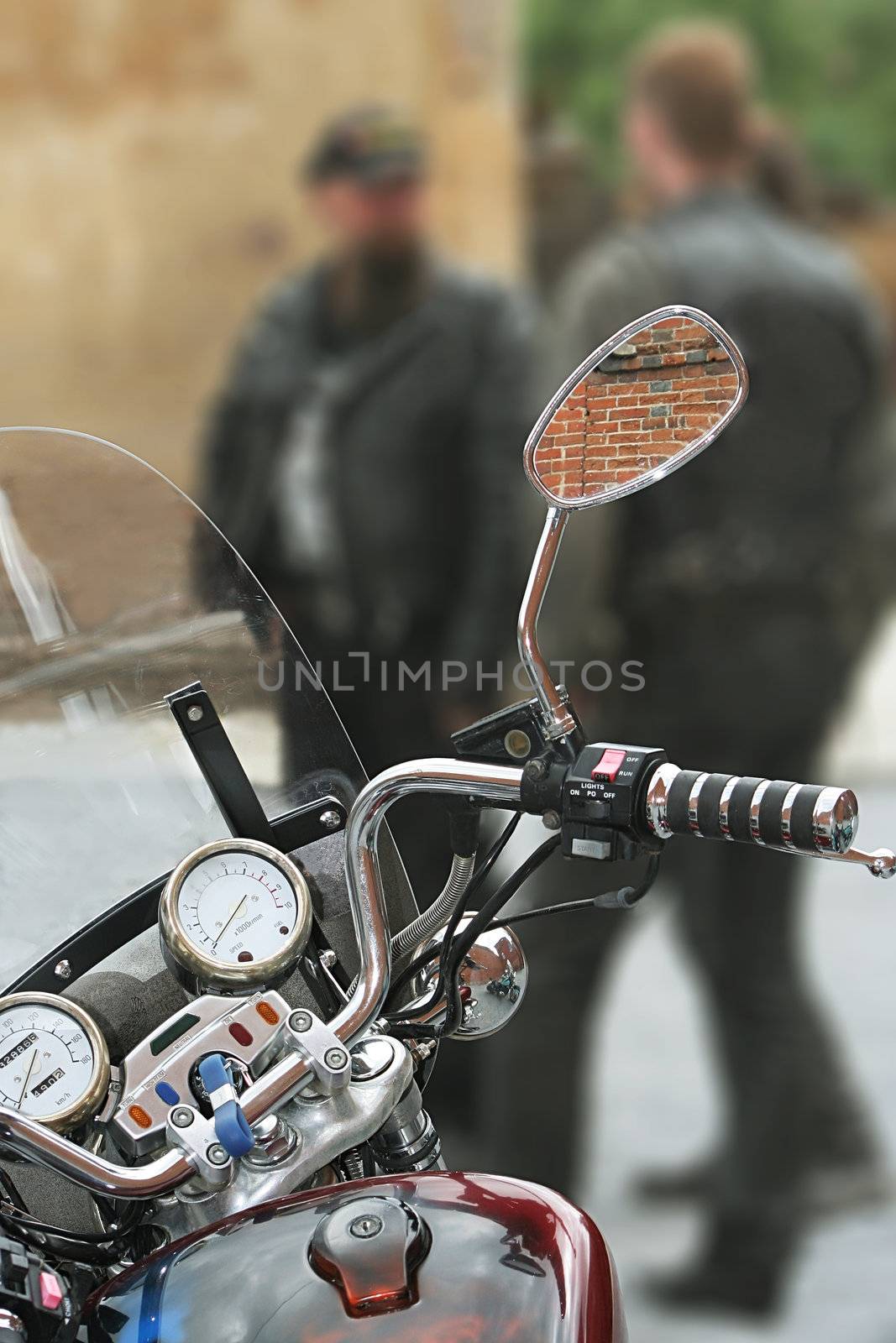 Modern motorcycle on a background of group of motorcyclists