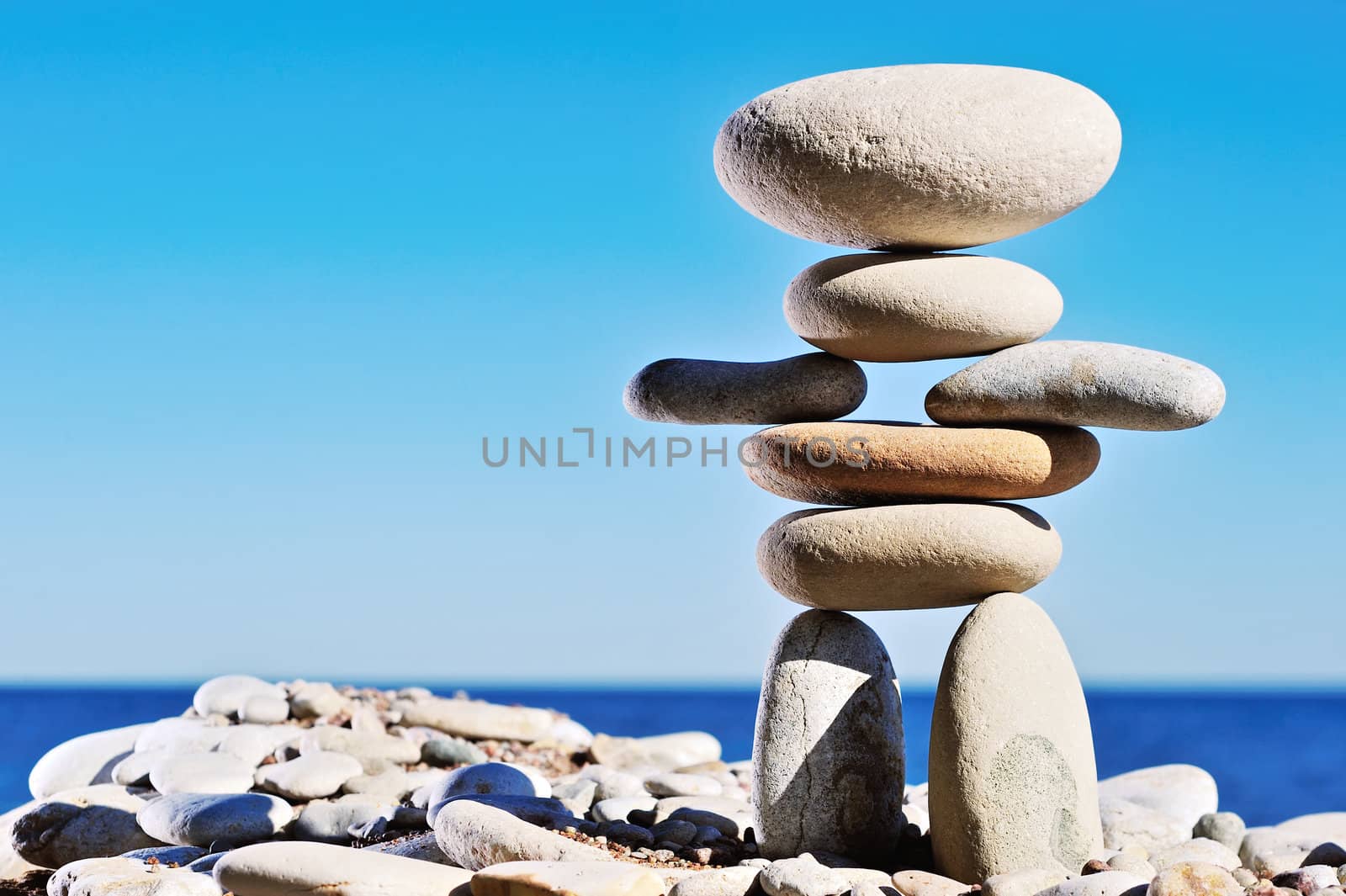 As sculpture of white gravel on the sea coast