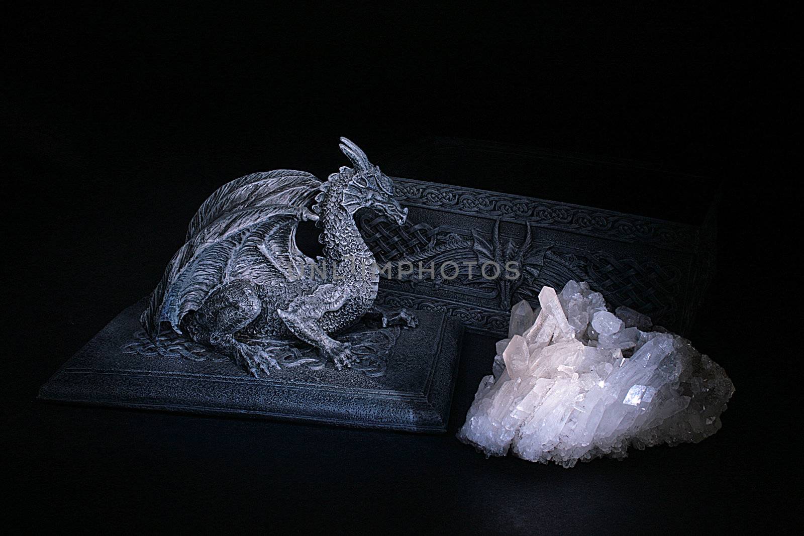 The casket on which cover lies a dragon and before a casket crystals for predictions lie.