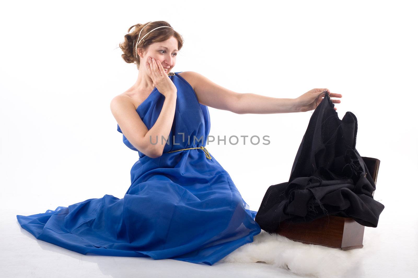 Lady in blue antique dress and open box on white background
