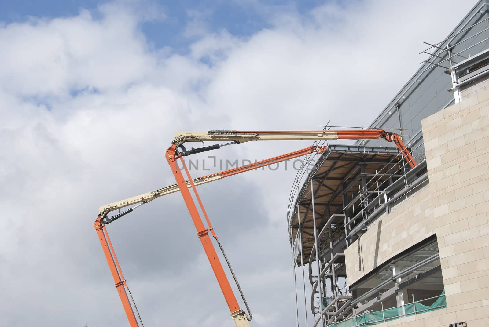 Two High Lift Cherry Picker Platforms on a Construction Site