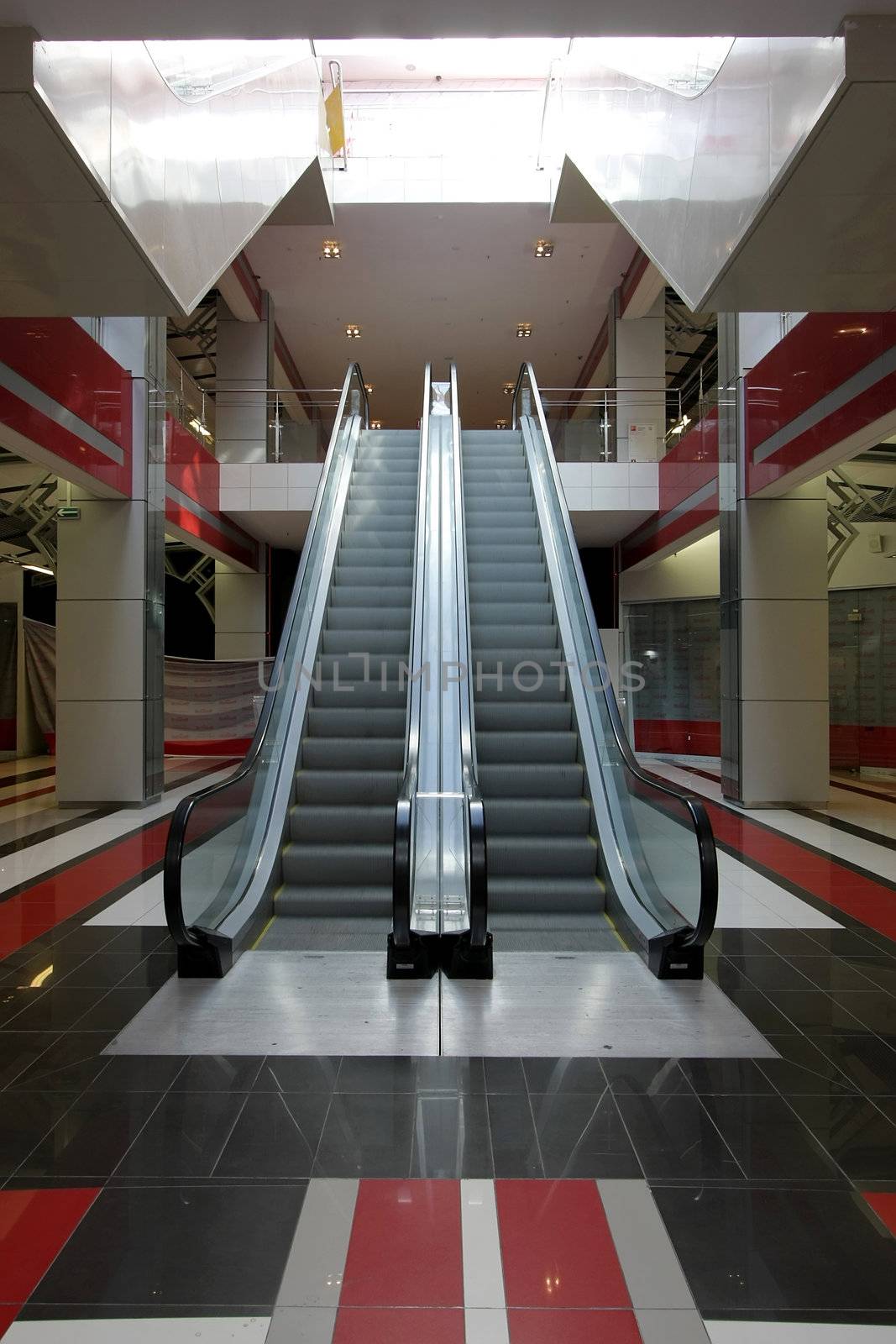 Interior of huge modern shopping centre
