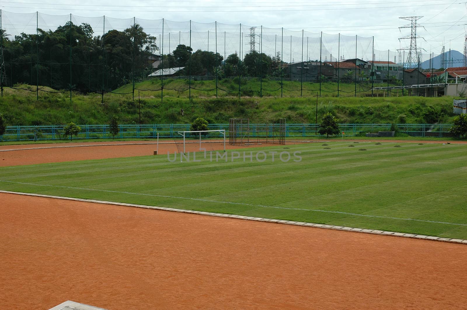 soccer field with nice green grass and blue sky