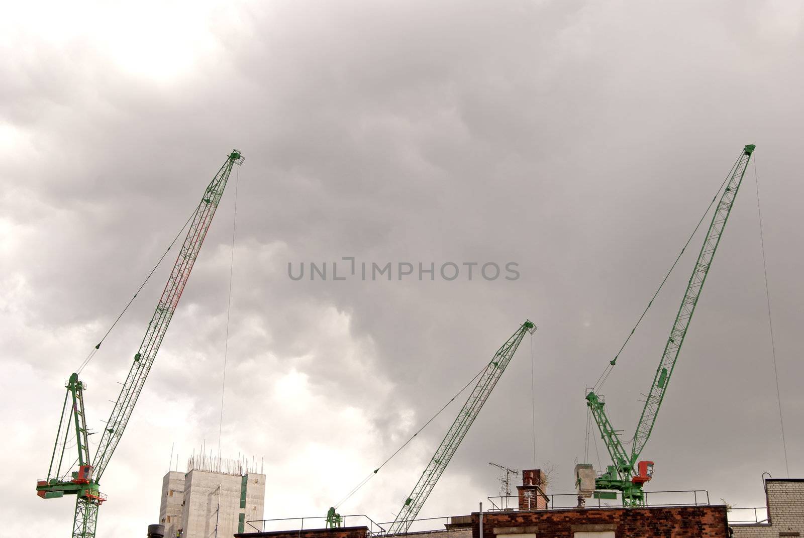 Three Heavy Lift Construction Cranes on a building site