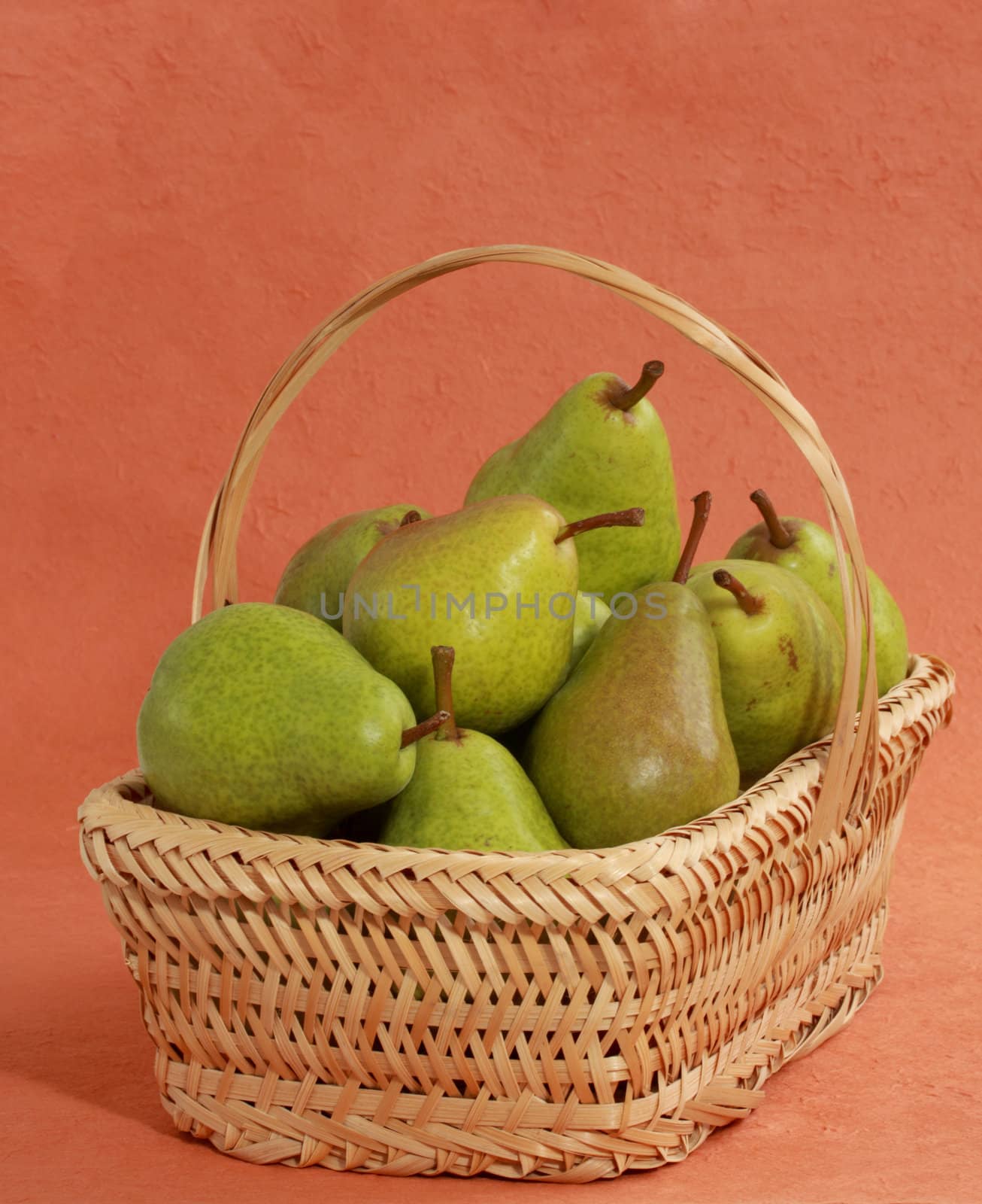 fresh pears in a wicker basket