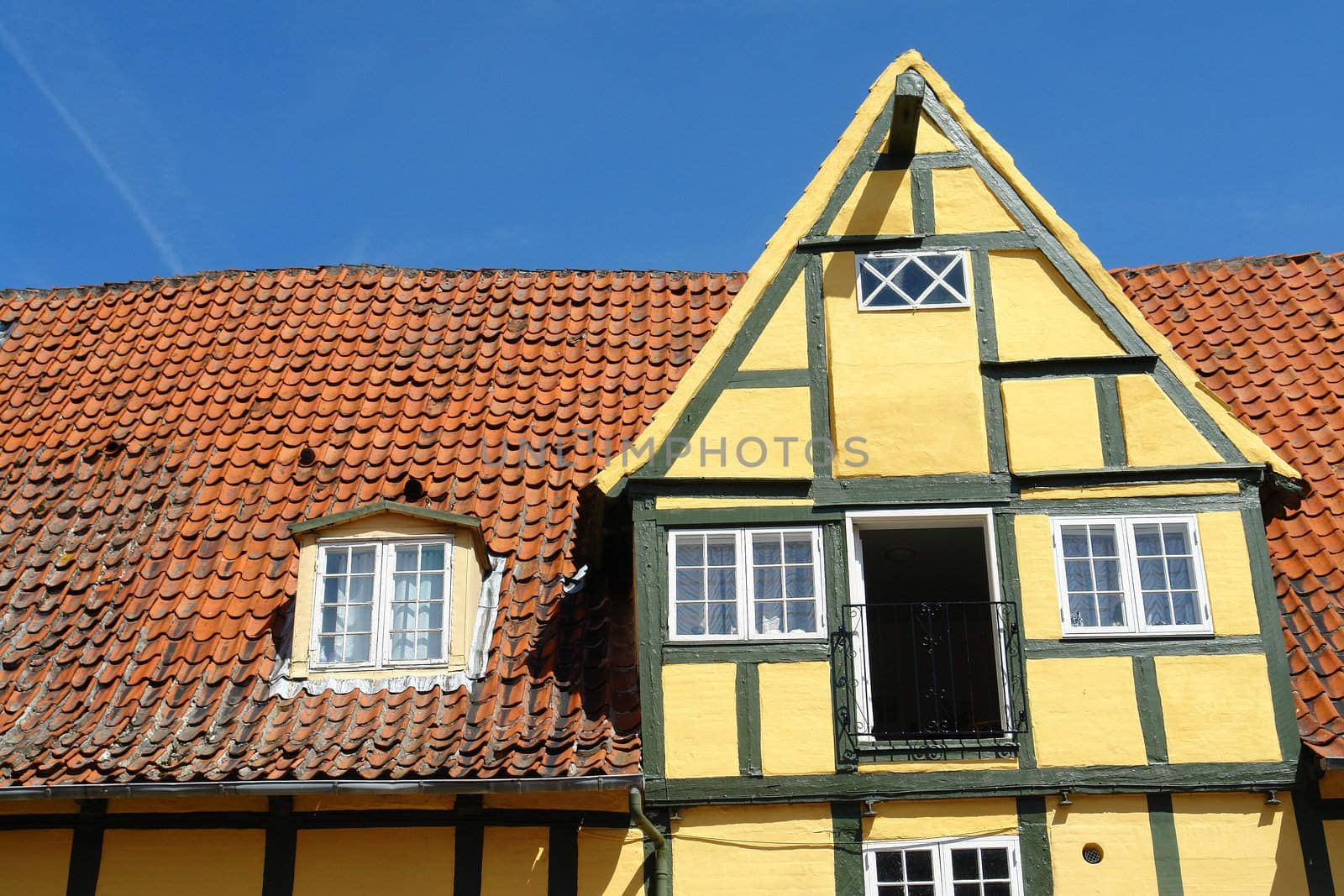 Facade of traditional old classic decorative style Danish country house home Denmark                               