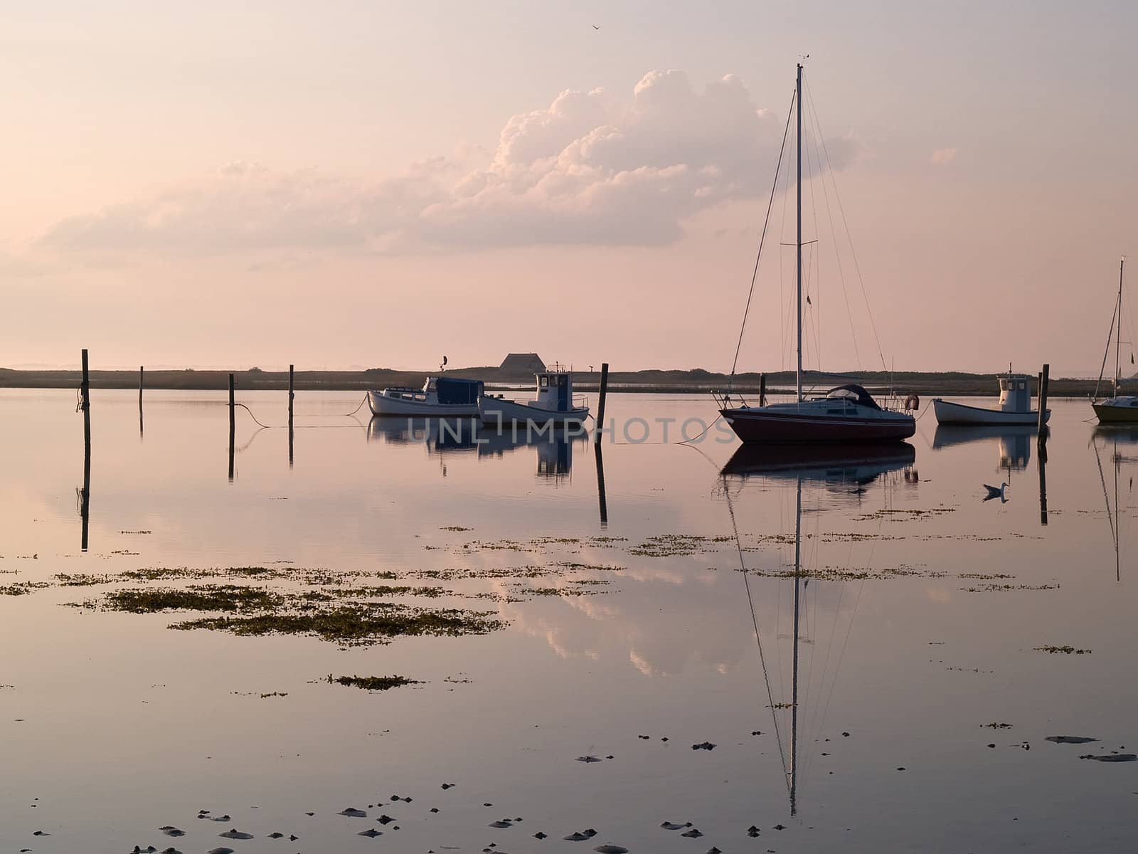 Magical sunset with boats reflection in the sea perfect sailing boating horizontal image