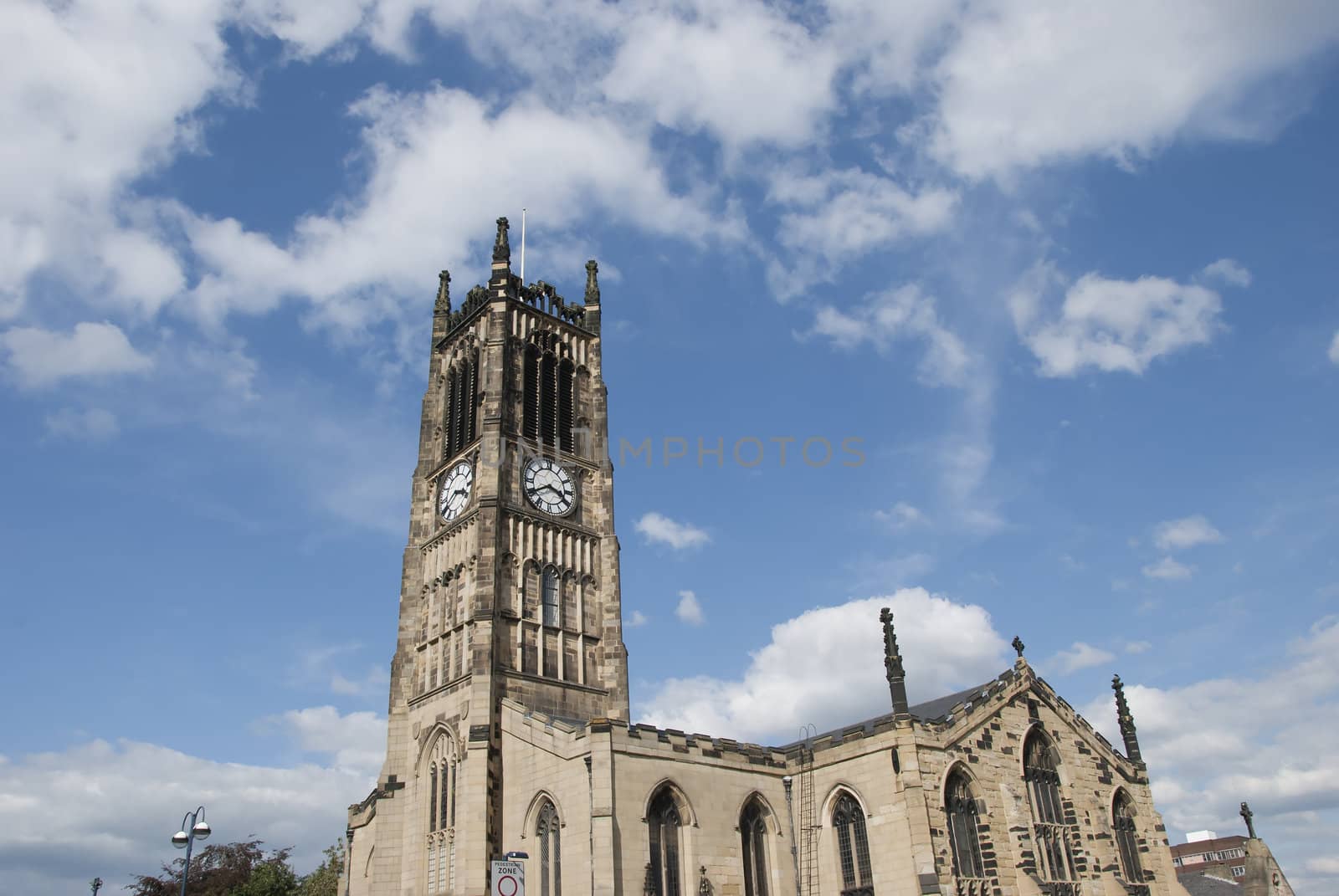 A Church and Clocktower in a Yorkshire Town under a blue sky